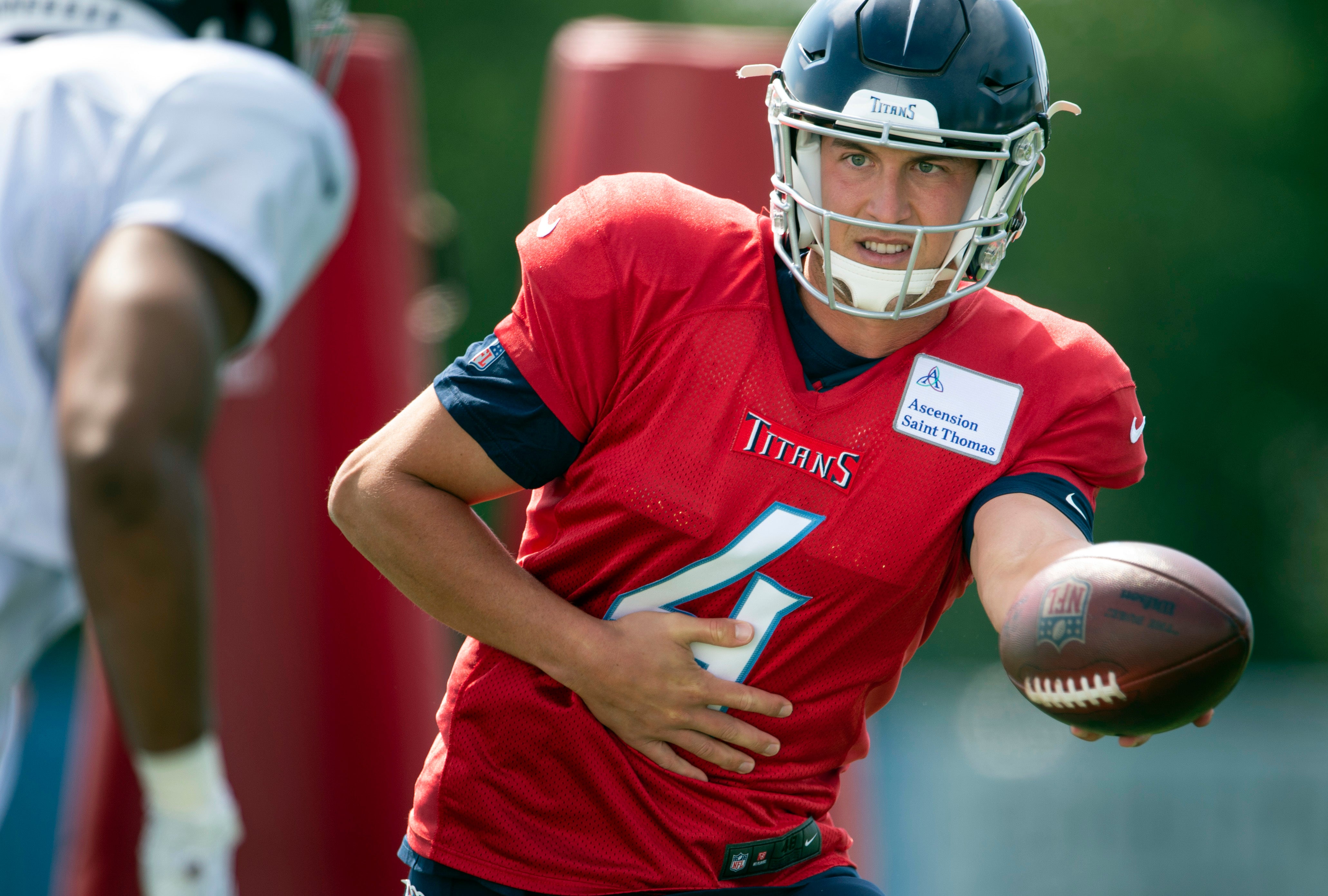Tennessee Titans quarterback Trevor Siemian (4) hands the ball off during a training camp practice at Saint Thomas Sports Park Thursday, Aug. 20, 2020 in Nashville, Tenn. George Walker IV-USA TODAY NETWORK