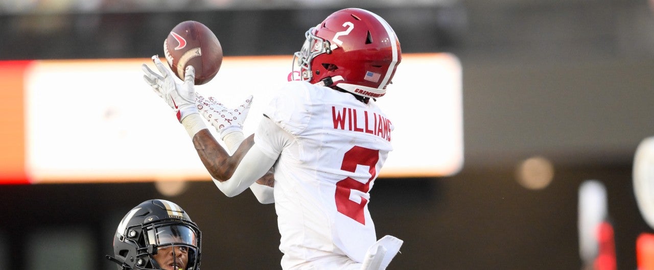 Oct 5, 2024; Nashville, Tennessee, USA; Alabama Crimson Tide wide receiver Ryan Williams (2) makes a catch over Vanderbilt Commodores cornerback Jaylin Lackey (27) during the second half at FirstBank Stadium.