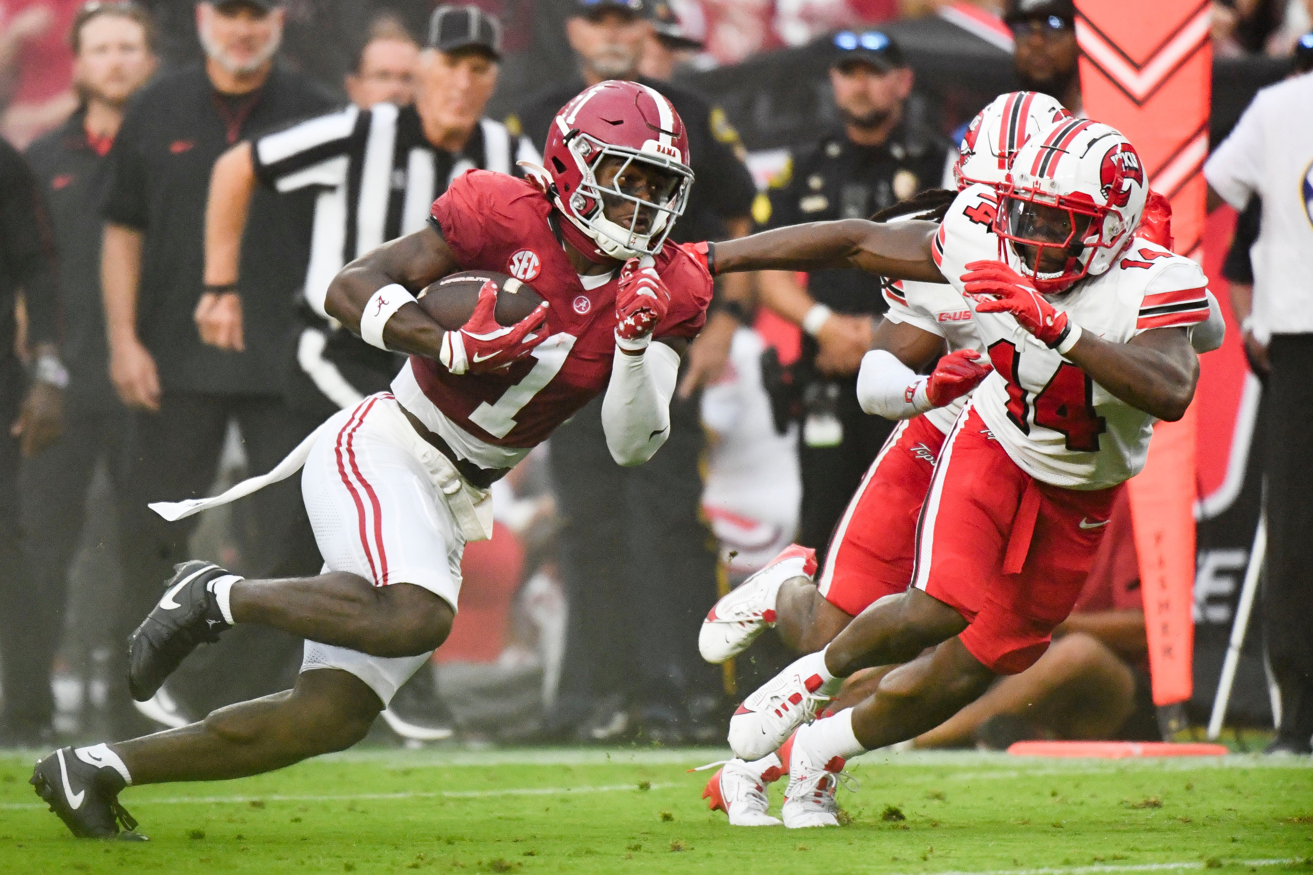 Aug 31, 2024; Tuscaloosa, Alabama, USA; Alabama Crimson Tide wide receiver Kendrick Law (1) runs the ball for a touchdown against Western Kentucky Hilltoppers safety Devonte' Mathews (14) during the first half at Bryant-Denny Stadium.