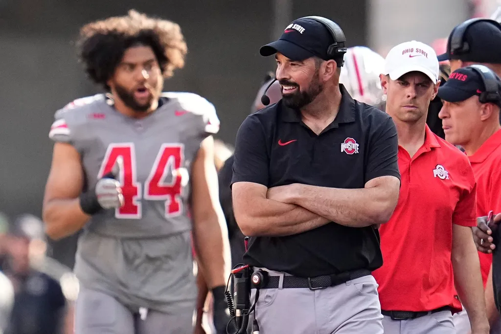 Ohio State Buckeyes head coach Ryan Day smiles on the sideline during the first half of the NCAA football game against the Iowa Hawkeyes at Ohio Stadium