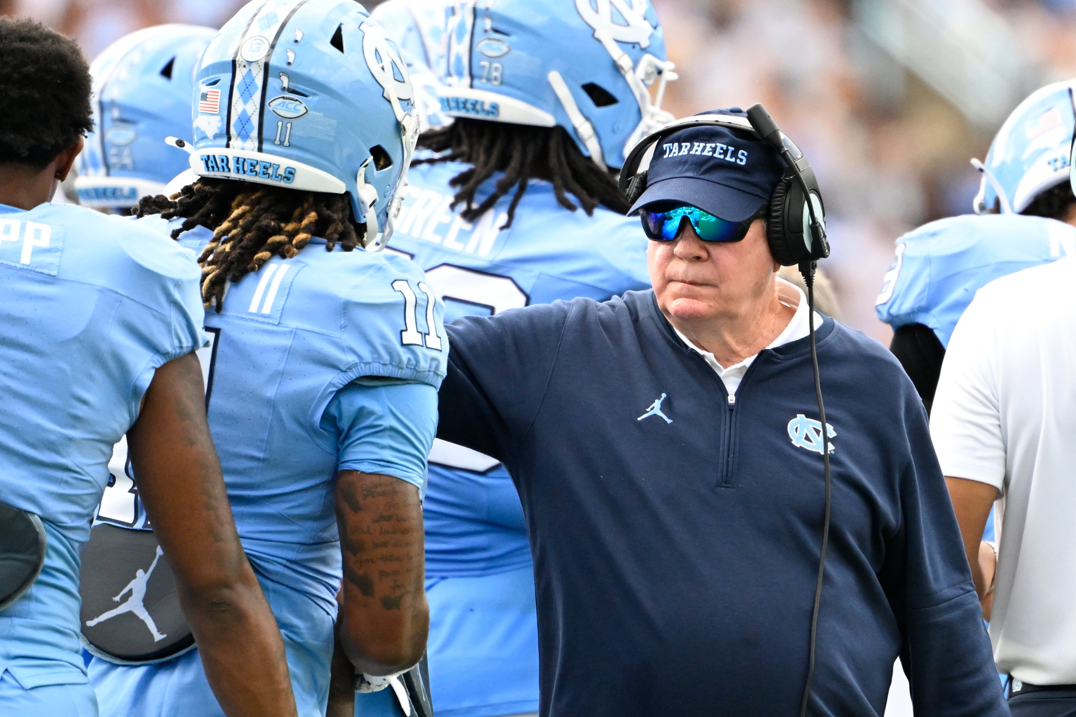North Carolina Tar Heels head coach Mack Brown with his players in the second quarter at Kenan Memorial Stadium.