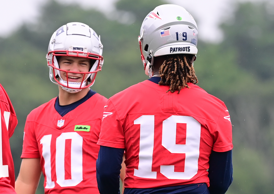 Jul 24, 2024; Foxborough, MA, USA; New England Patriots quarterback Drake Maye (10) waits for drills to start with quarterback Jacoby Brissett (14) and quarterback Joe Milton III (19) training camp at Gillette Stadium. 