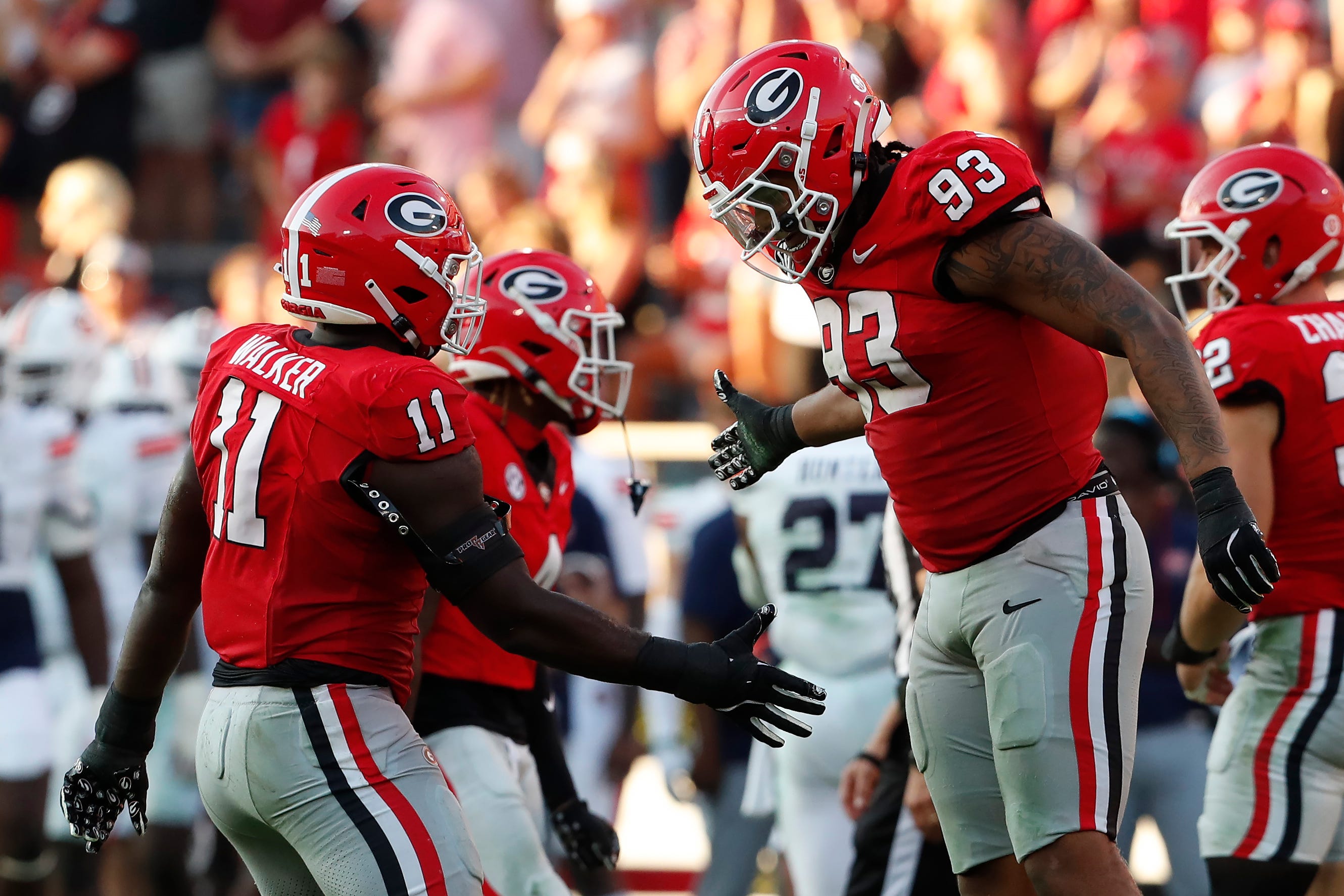 Georgia linebacker Jalon Walker (11) and Georgia defensive lineman Tyrion Ingram-Dawkins (93) celebrate after the sack during the second half of a NCAA college football game against Auburn in Athens, Ga., on Saturday, Oct. 5, 2024.
