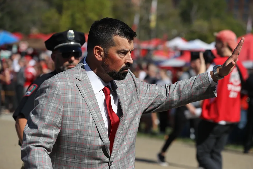Ohio State Buckeyes head coach Ryan Day greets fans before the game against the Iowa Hawkeyes at Ohio Stadium.