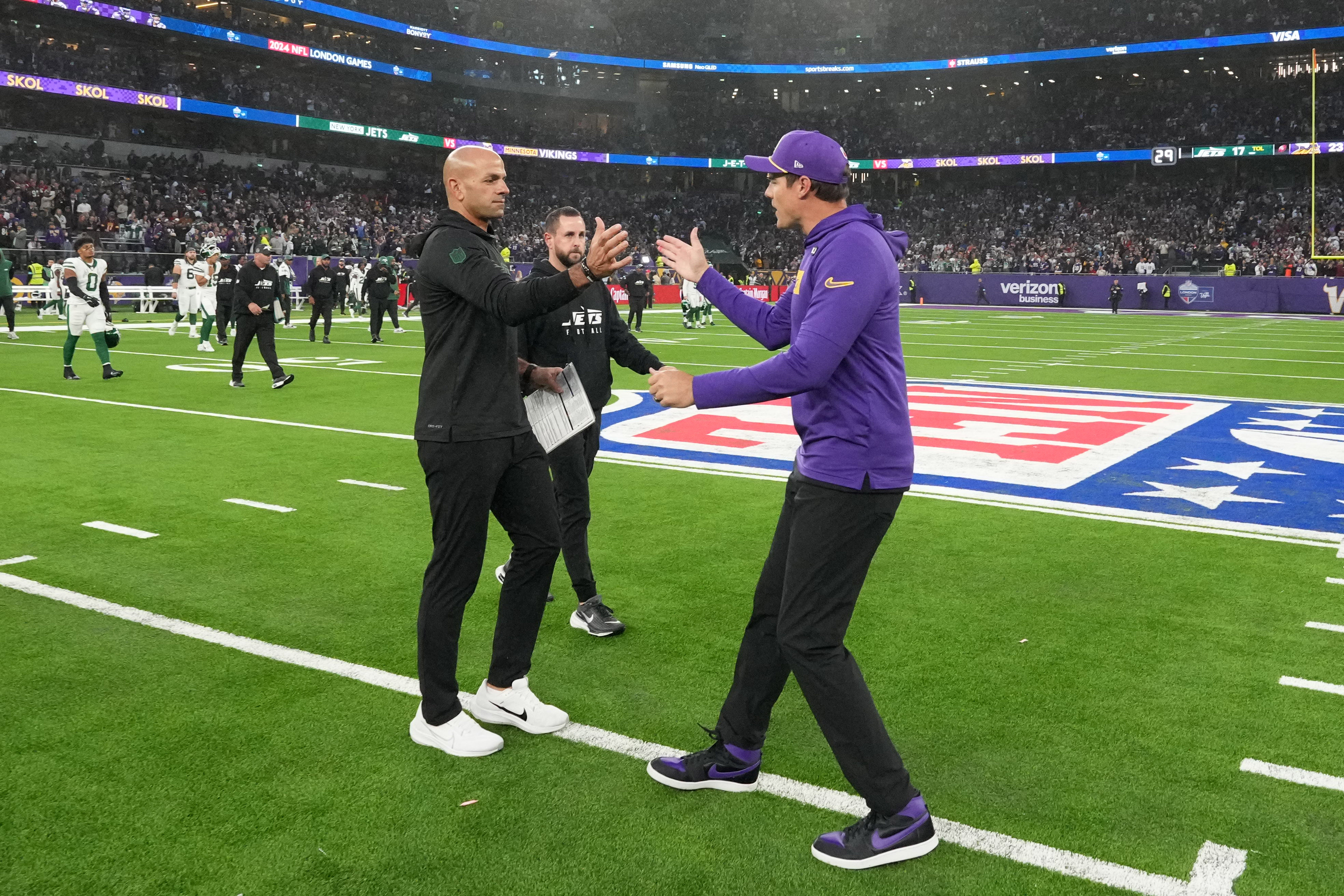 Oct 6, 2024; London, United Kingdom; New York Jets coach Robert Saleh (left) and Minnesota Vikings coach Kevin O'Connell shake hands after the game at Tottenham Hotspur Stadium.