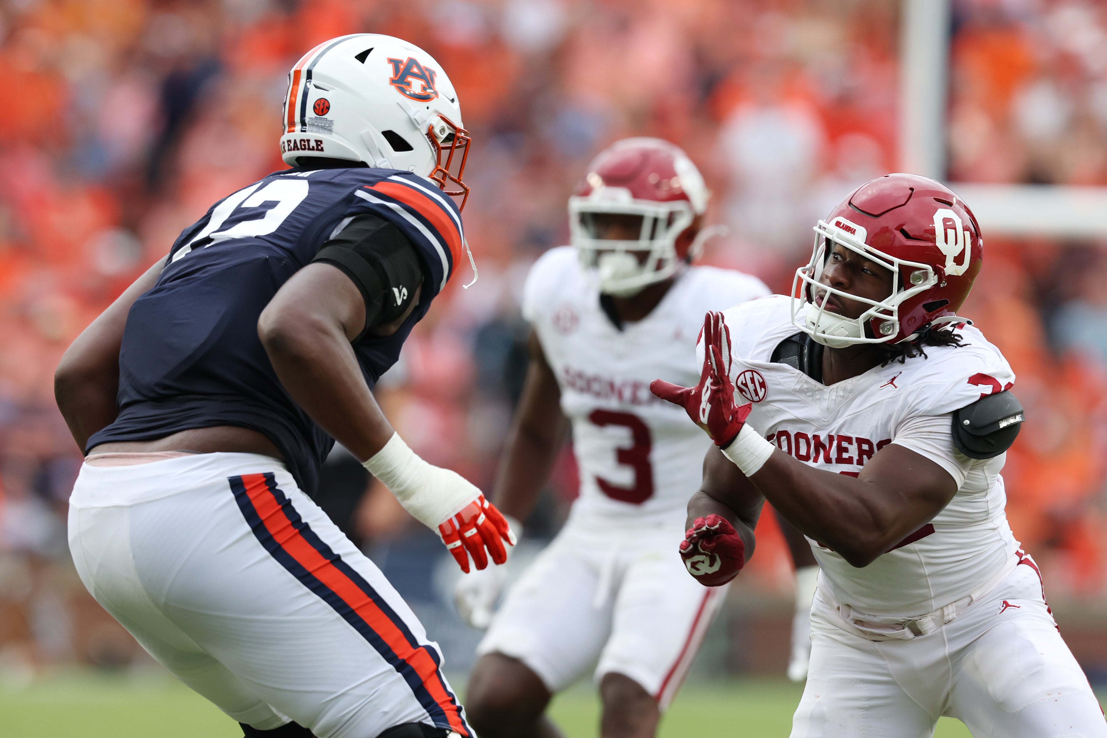 Sep 28, 2024; Auburn, Alabama, USA; Oklahoma Sooners defensive lineman R Mason Thomas (32) moves in to block Auburn Tigers offensive lineman Izavion Miller (72) during the third quarter at Jordan-Hare Stadium.