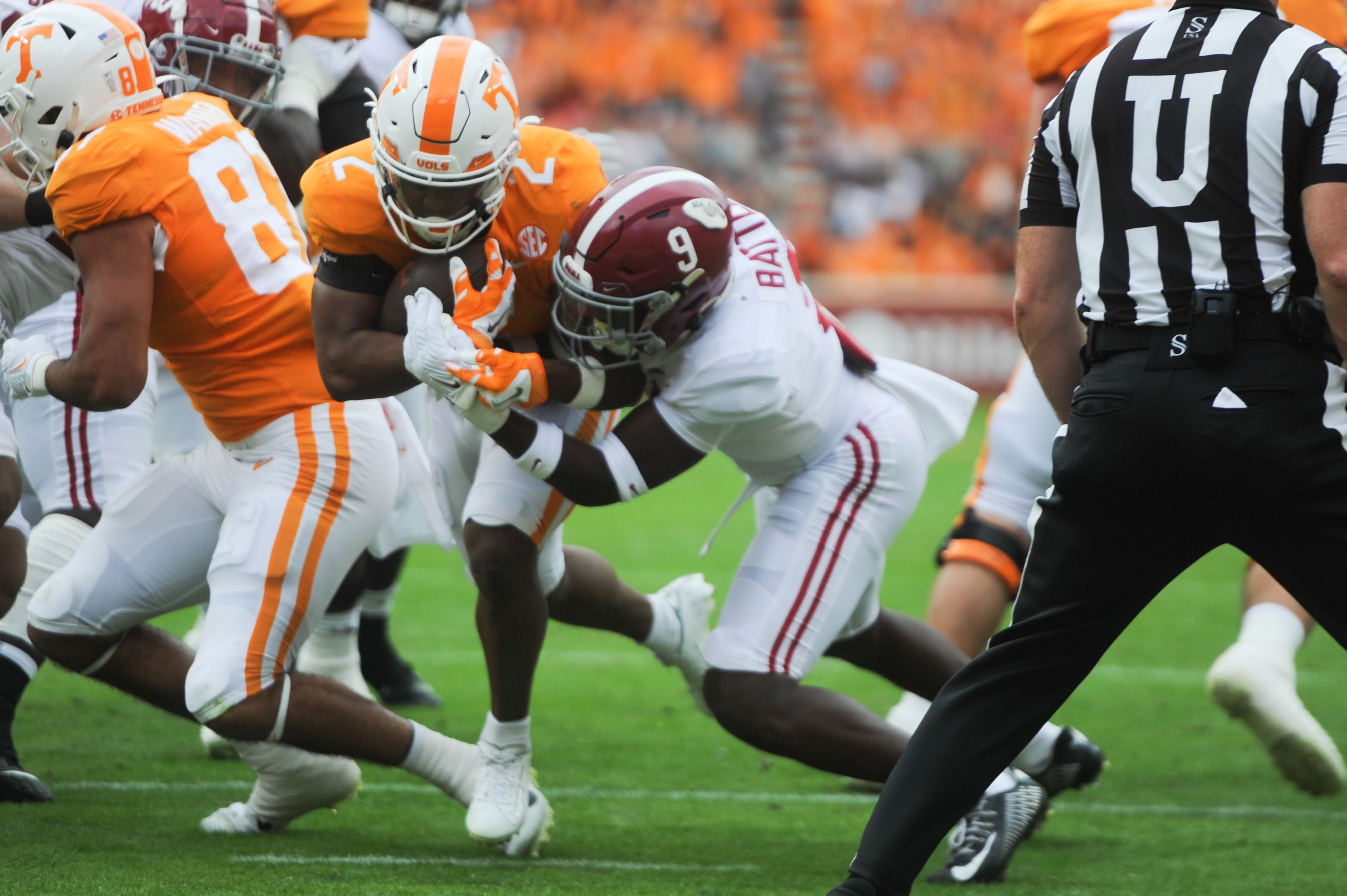 Tennessee running back Jabari Small (2) fights through contact from Alabama defensive back Jordan Battle (9) during a game between Tennessee and Alabama in Neyland Stadium, on Saturday, Oct. 15, 2022.
