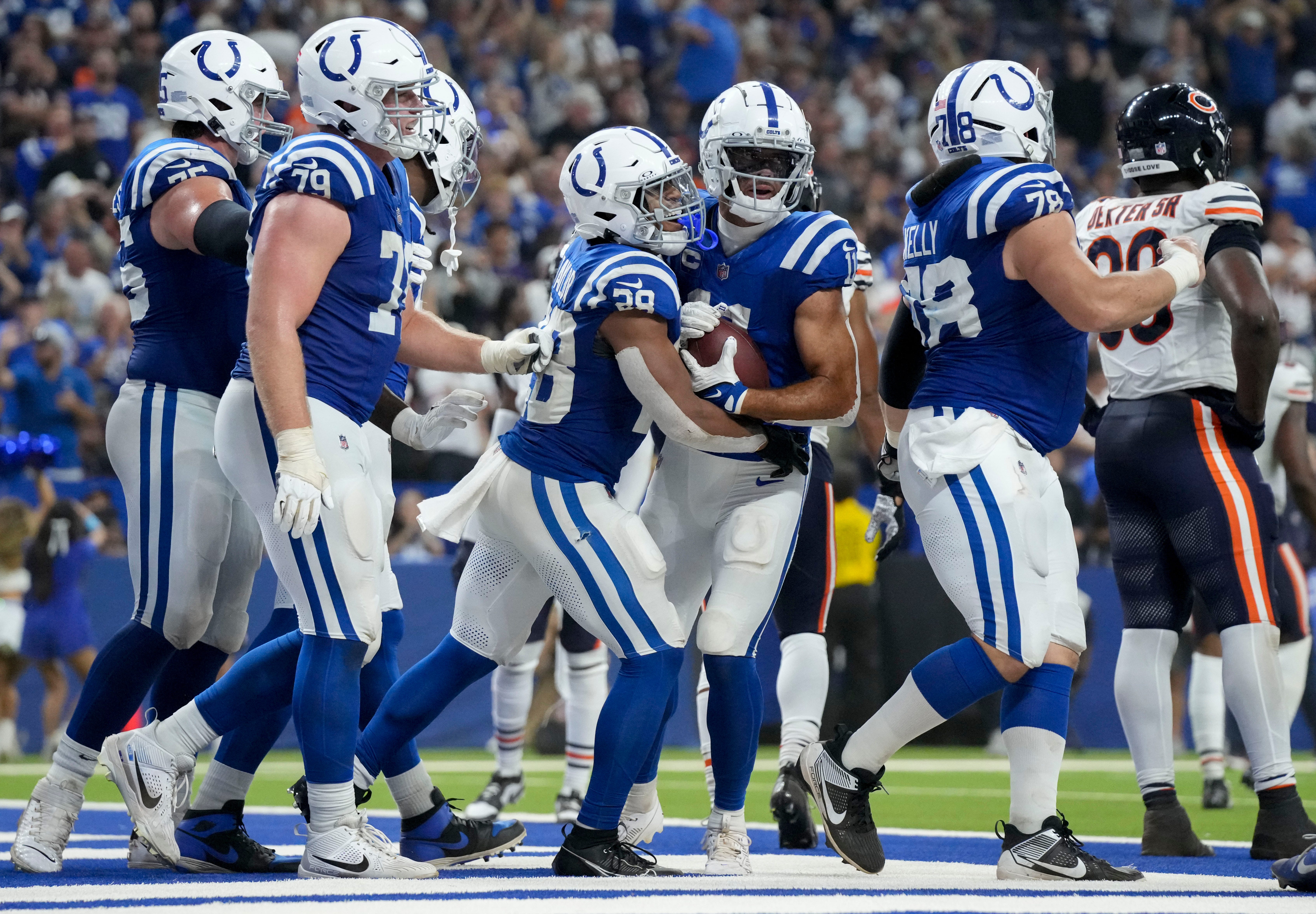 Indianapolis Colts running back Jonathan Taylor (28) celebrates with Indianapolis Colts wide receiver Michael Pittman Jr. (11) after scoring a touchdown Sunday, Sept. 22, 2024, during a game against the Chicago Bears at Lucas Oil Stadium in Indianapolis.