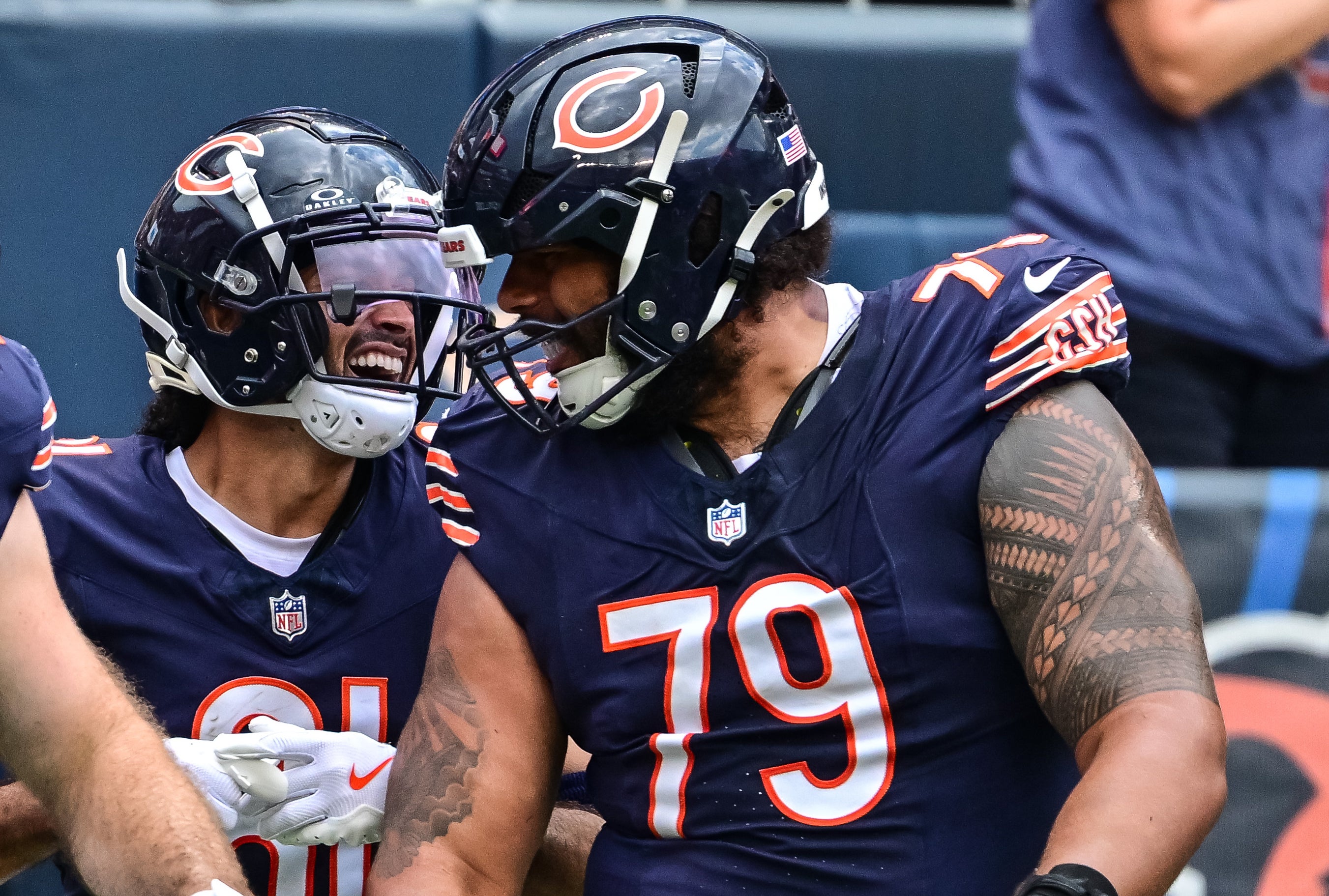 Aug 17, 2024; Chicago, Illinois, USA; Chicago Bears wide receiver Dante Pettis (81) celebrates his touchdown reception with tight end Tommy Sweeney (47) and offensive tackle Matt Pryor (79) against the Cincinnati Bengals during the third quarter at Soldier Field. Mandatory Credit: