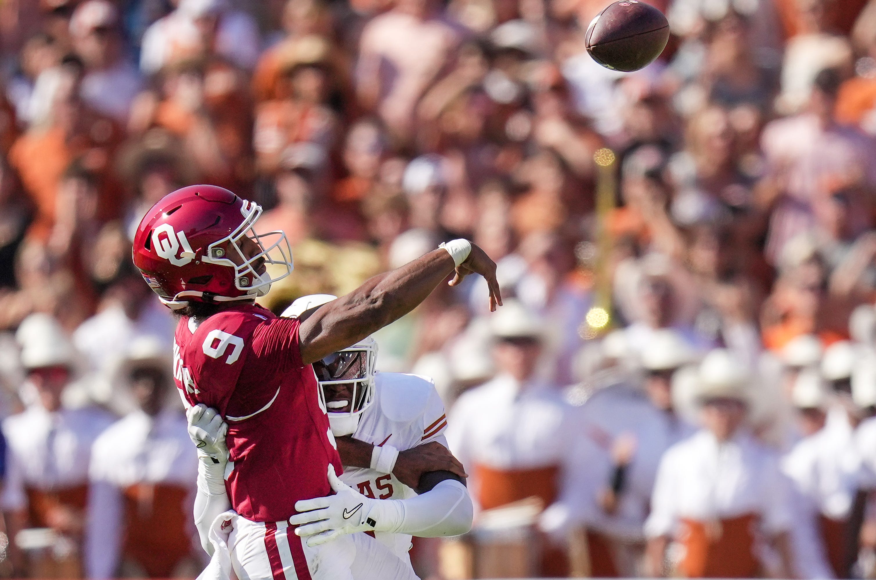 Texas Longhorns defensive back Jahdae Barron (7) rushes Oklahoma Sooners quarterback Michael Hawkins Jr. (9) in the first quarter during the Red River Rivalry Football Game between the University of Oklahoma Sooners and the University of Texas Longhorns at the Cotton Bowl Stadium in Dallas, TX on Saturday Oct. 12, 2024.