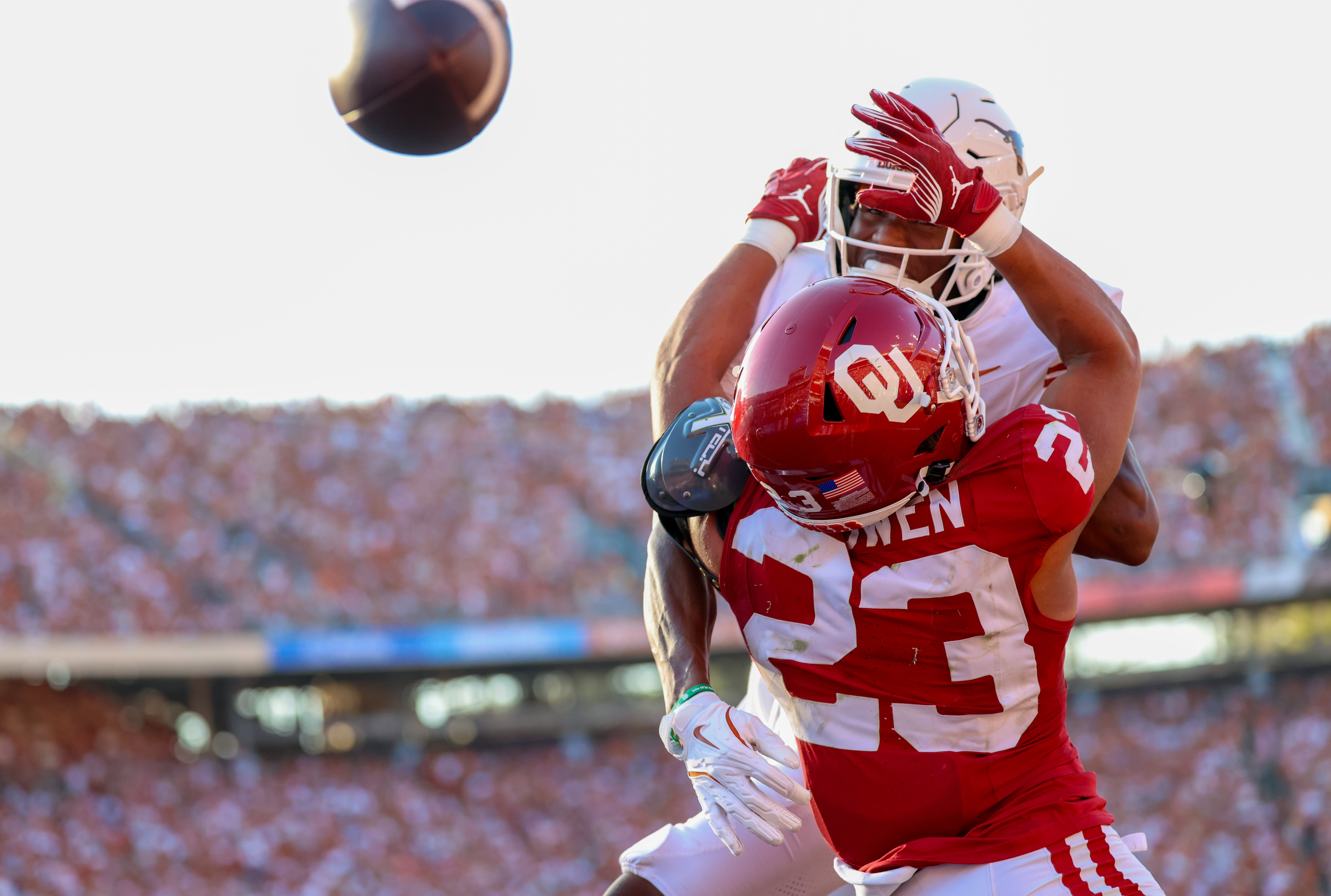 Oct 12, 2024; Dallas, Texas, USA; Oklahoma Sooners defensive back Eli Bowen (23) defends a pass intended for Texas Longhorns wide receiver Ryan Wingo (5) during the second half at the Cotton Bowl.