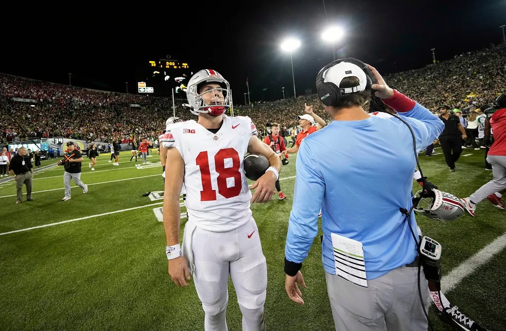 Ohio State Buckeyes quarterback Will Howard (18) walks off the field after losing 32-31 to Oregon Ducks during the NCAA football game at Autzen Stadium