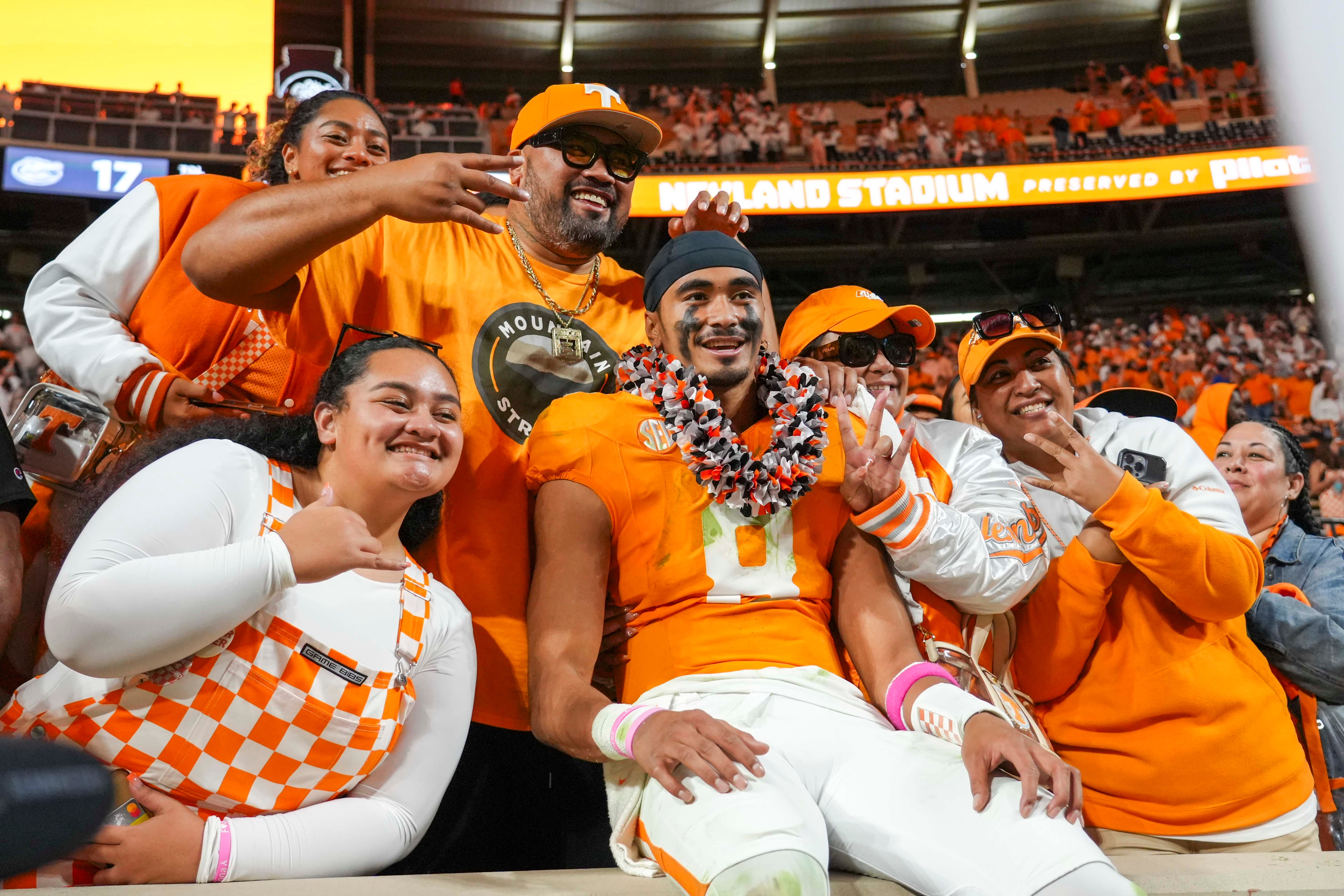 Tennessee quarterback Nico Iamaleava (8) poses for a picture with his family after a NCAA football game between Tennessee and Florida in Neyland Stadium, in Knoxville, Tenn., Oct. 12, 2024.