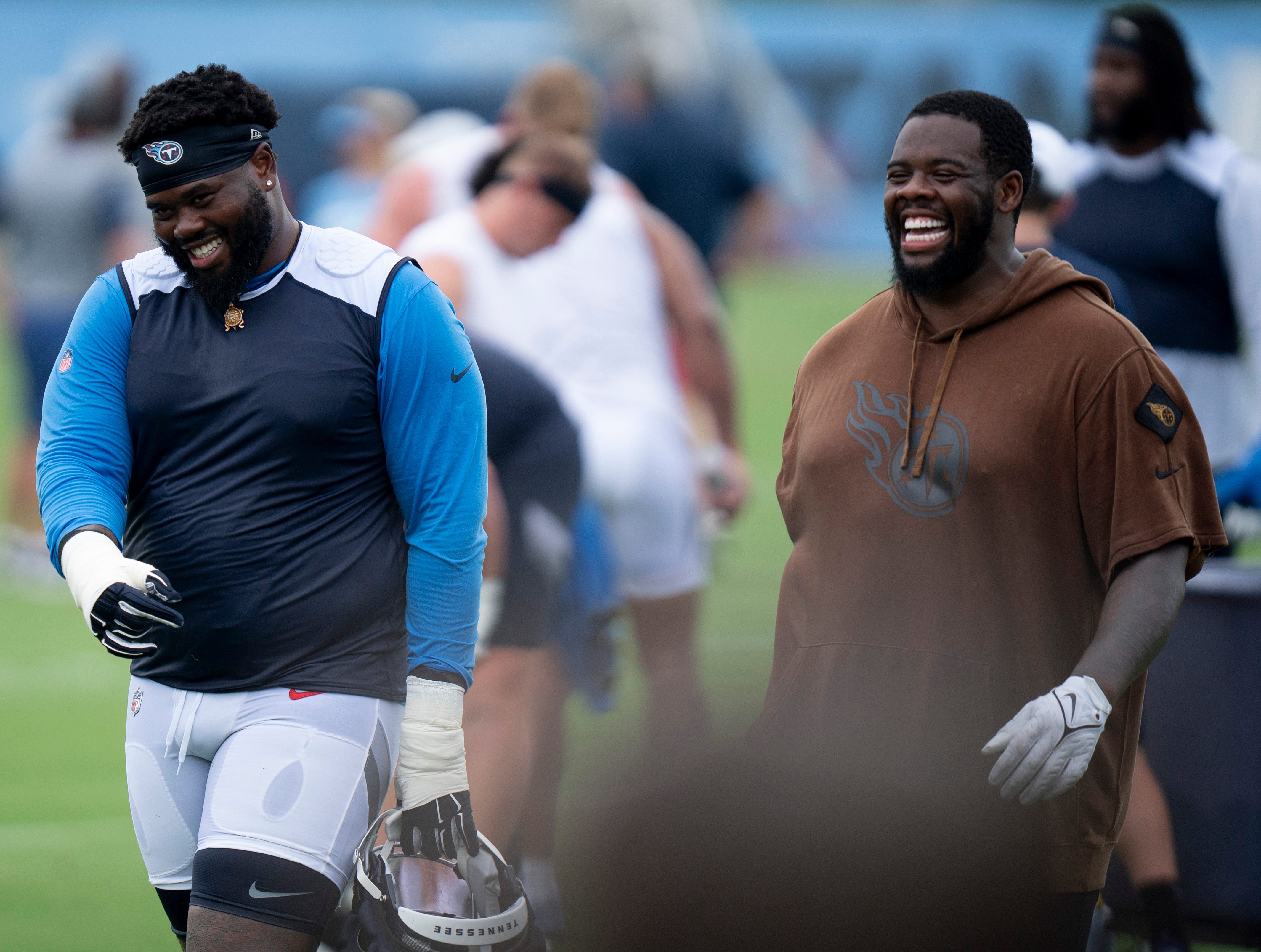 Tennessee Titans tackles Geron Christian, left, and Leroy Watson IV head off the field after practice on the second day of training camp Thursday, July 25, 2024 Denny Simmons/The Tennessean-USA TODAY NETWORK