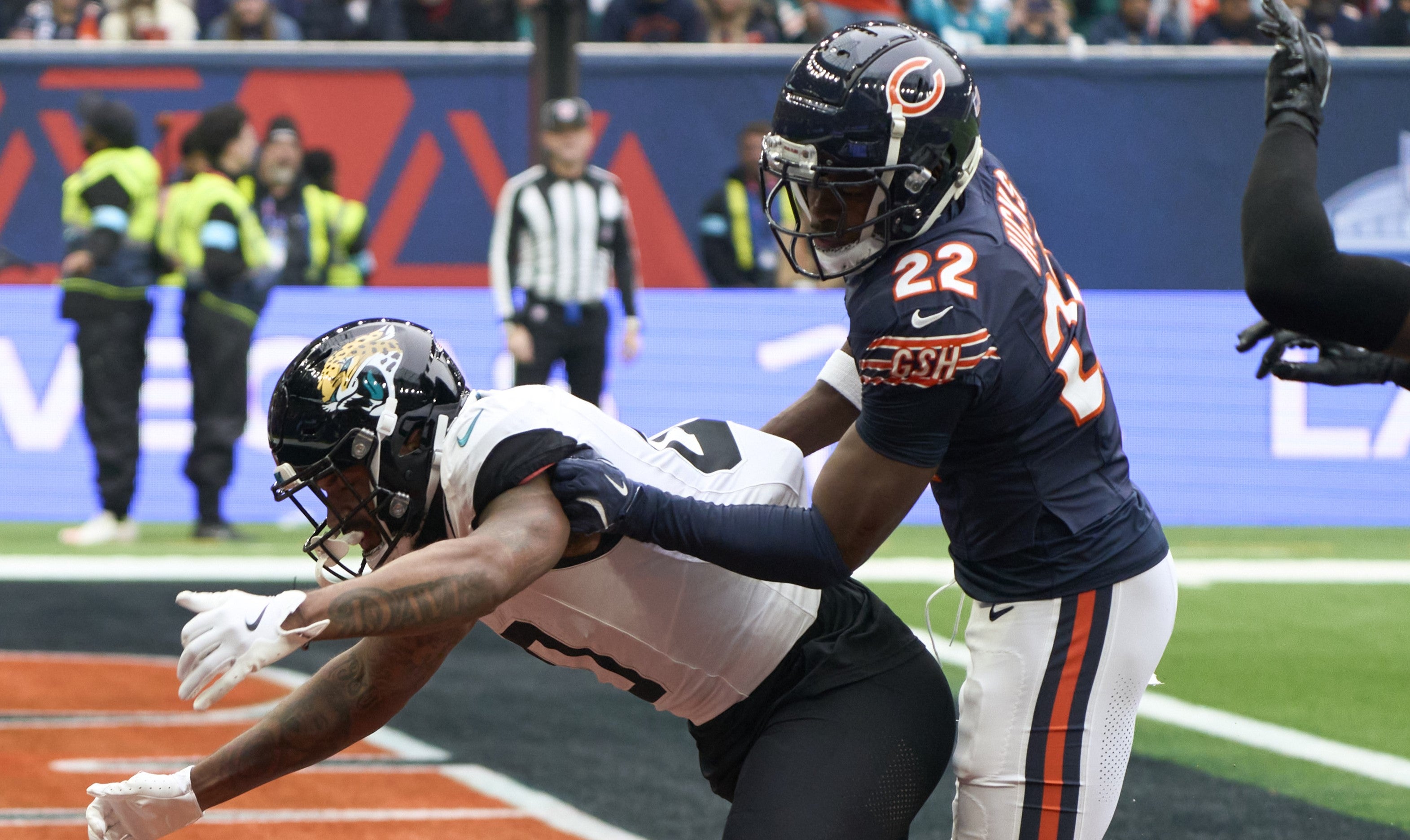 Oct 13, 2024; London, United Kingdom; Chicago Bears safety Elijah Hicks (22) breaks up a pass in the end zone for Jacksonville Jaguars wide receiver Gabe Davis (0) during an NFL International Series game at Tottenham Hotspur Stadium.