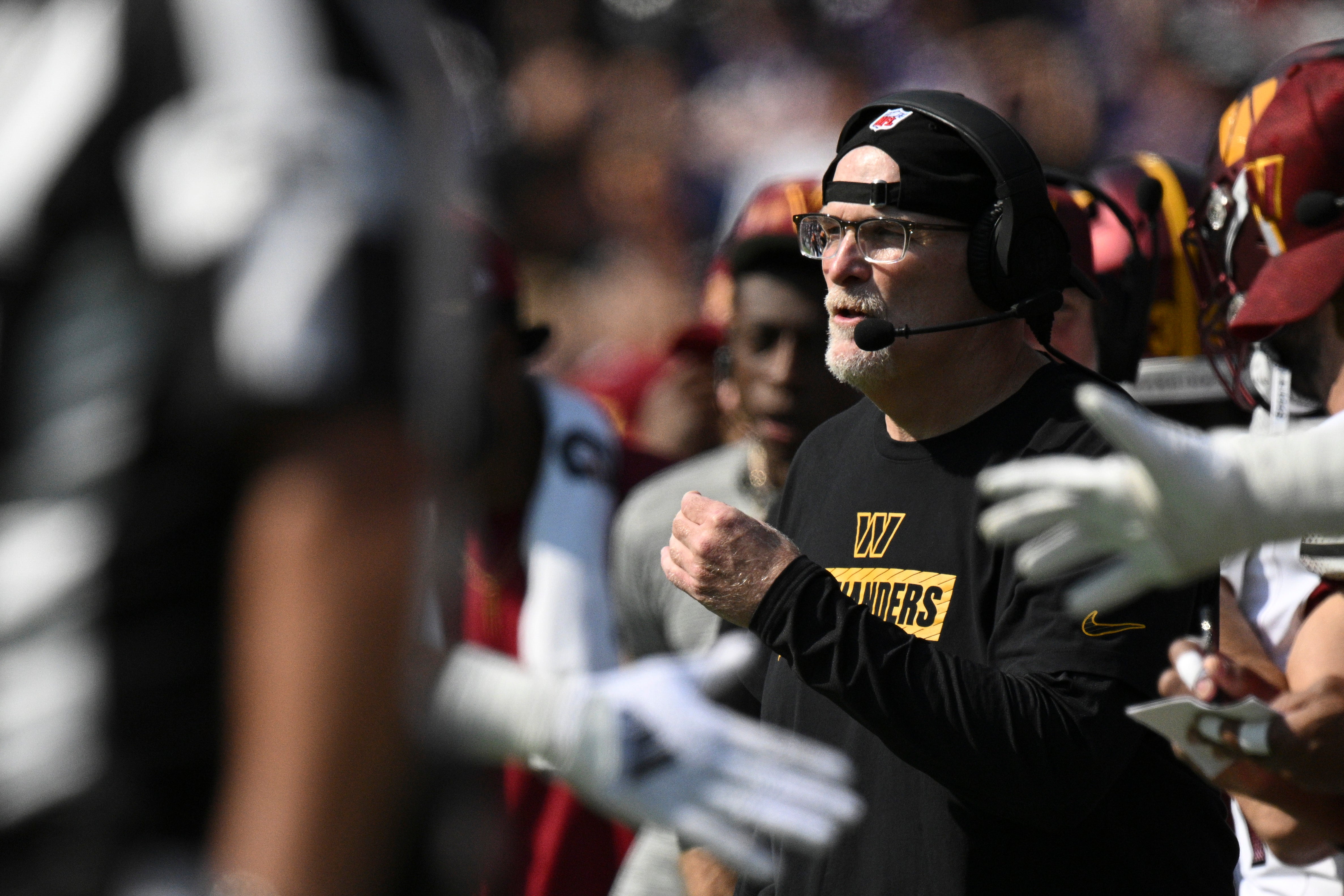 Oct 13, 2024; Baltimore, Maryland, USA; Washington Commanders head coach Dan Quinn reacts during the first half against the Baltimore Ravens at M&T Bank Stadium.