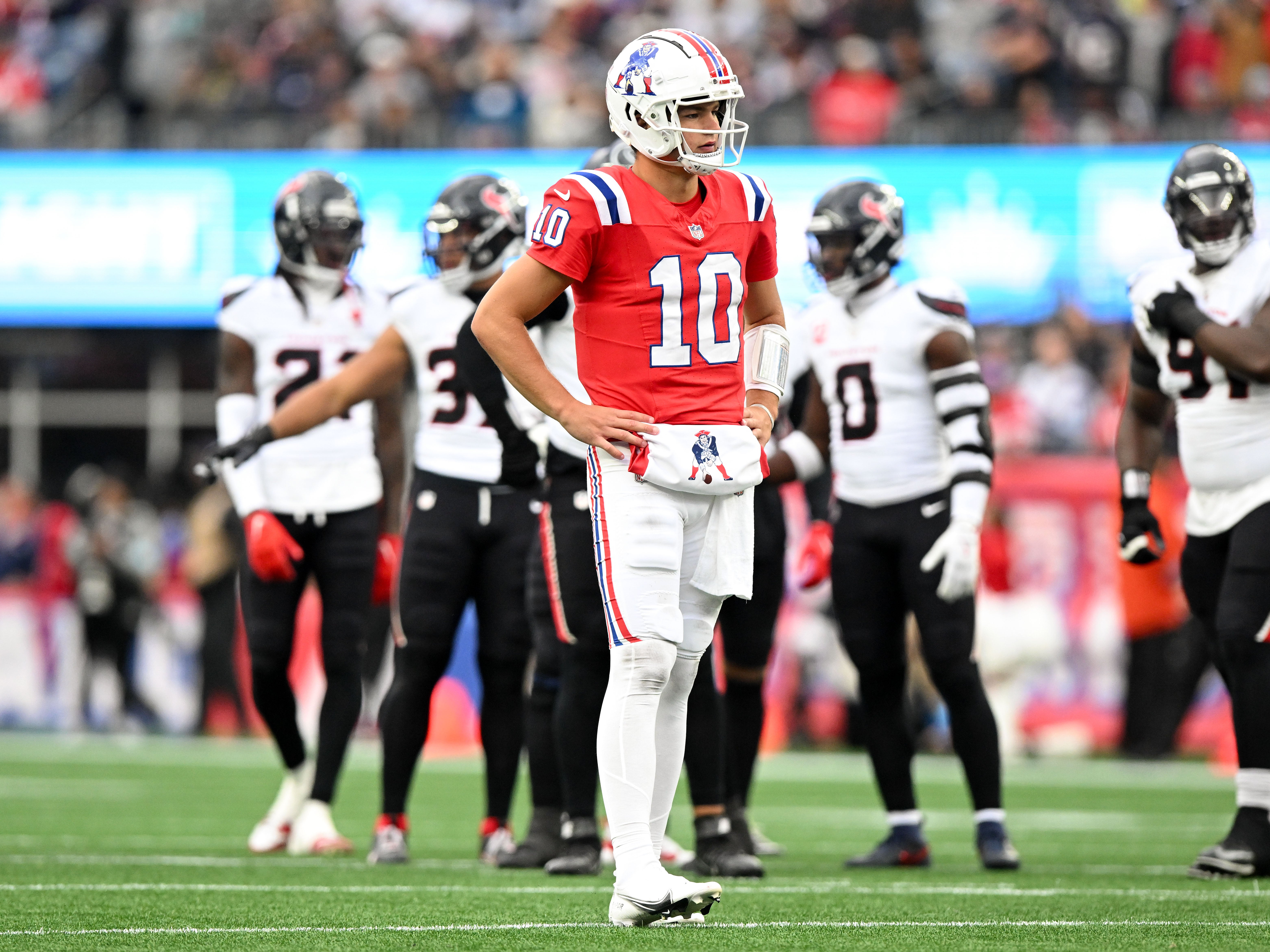Oct 13, 2024; Foxborough, Massachusetts, USA; New England Patriots quarterback Drake Maye (10) reacts after a sack during the first half of a game against the Houston Texans at Gillette Stadium.