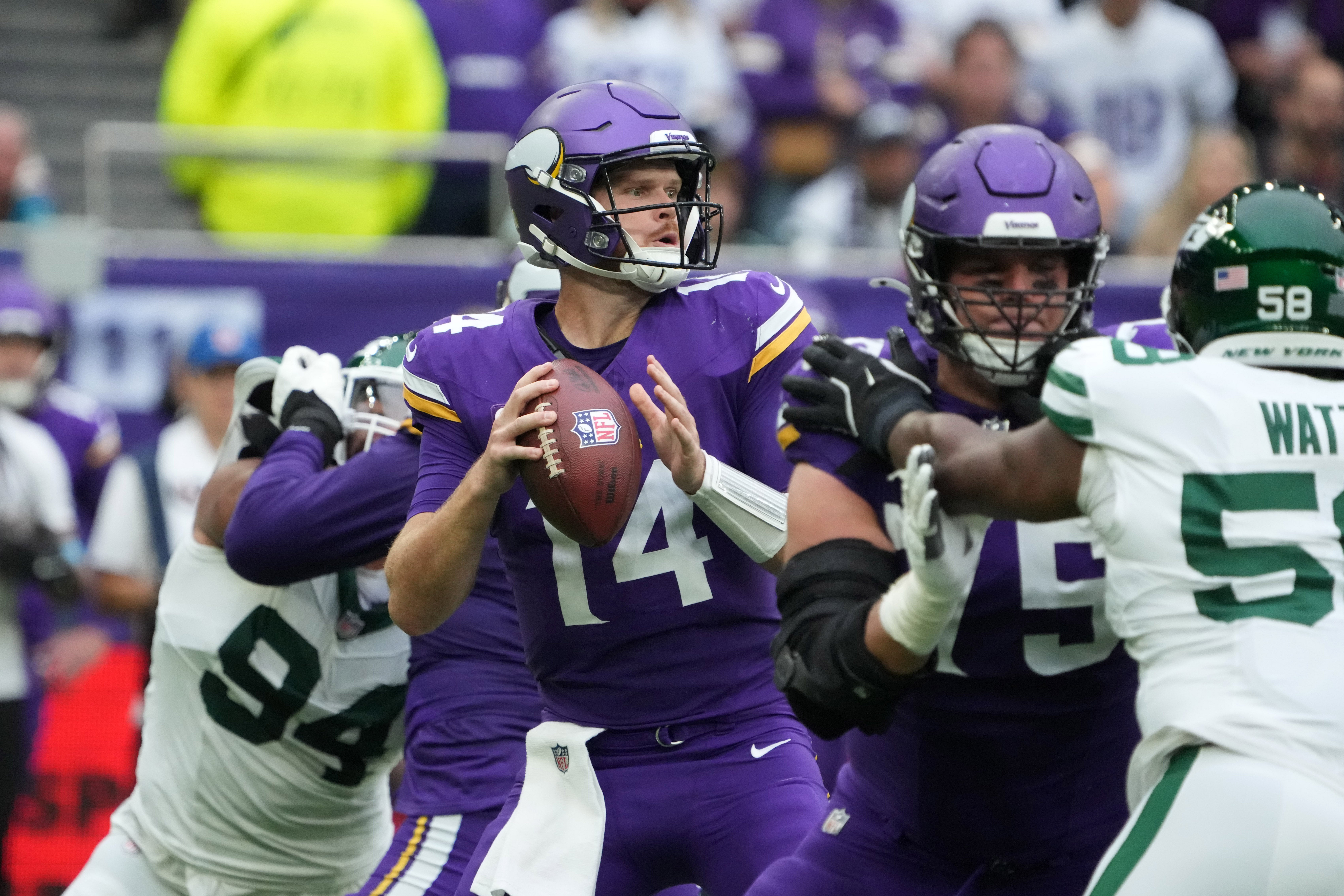 Oct 6, 2024; London, United Kingdom; Minnesota Vikings quarterback Sam Darnold (14) throws the ball against the New York Jets in the first half at Tottenham Hotspur Stadium.