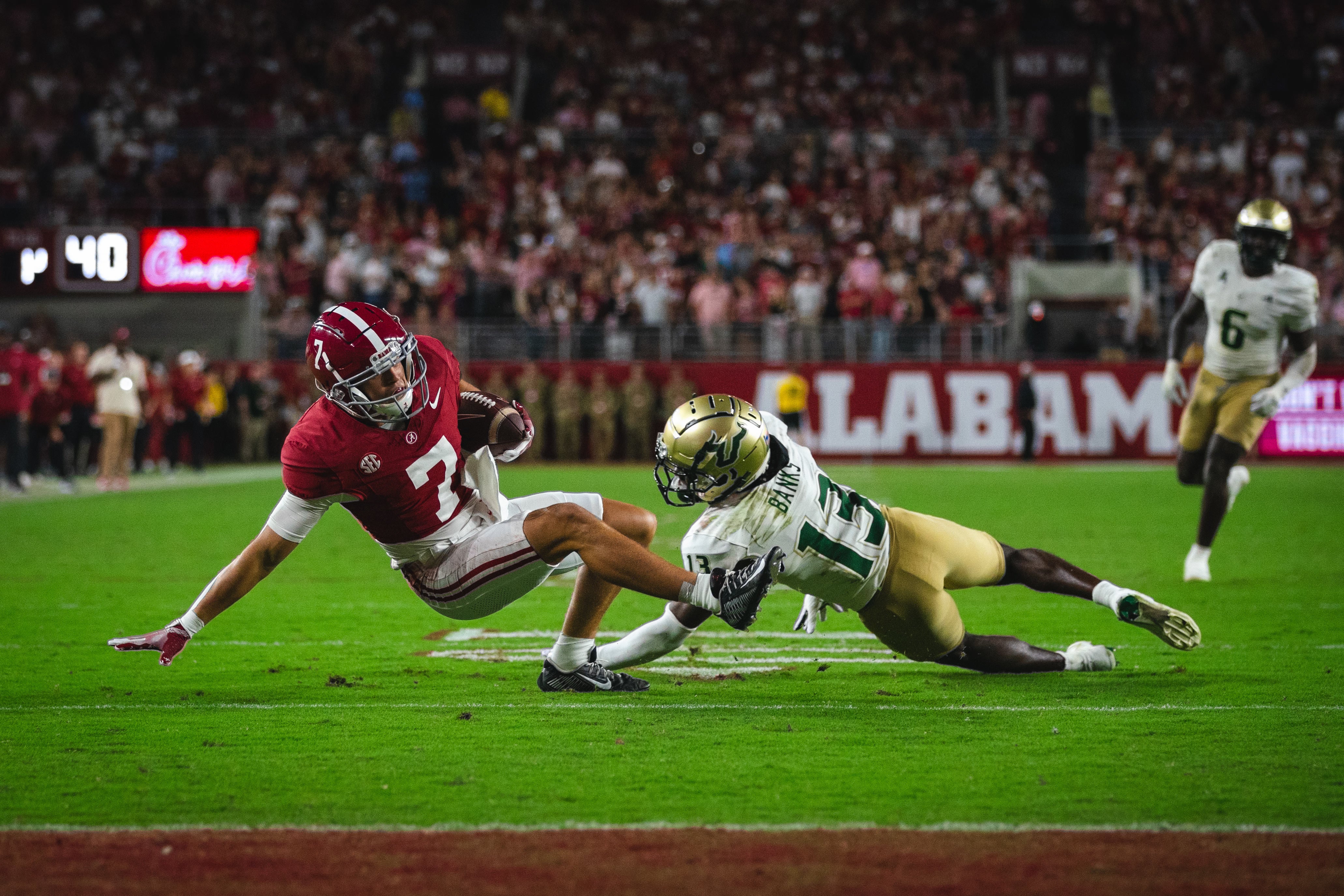 Sep 7, 2024; Tuscaloosa, Alabama, USA; South Florida Bulls defensive back Kajuan Banks brings down Alabama Crimson Tide wide receiver Cole Adams (7) near the end zone during the fourth quarter at Bryant-Denny Stadium.