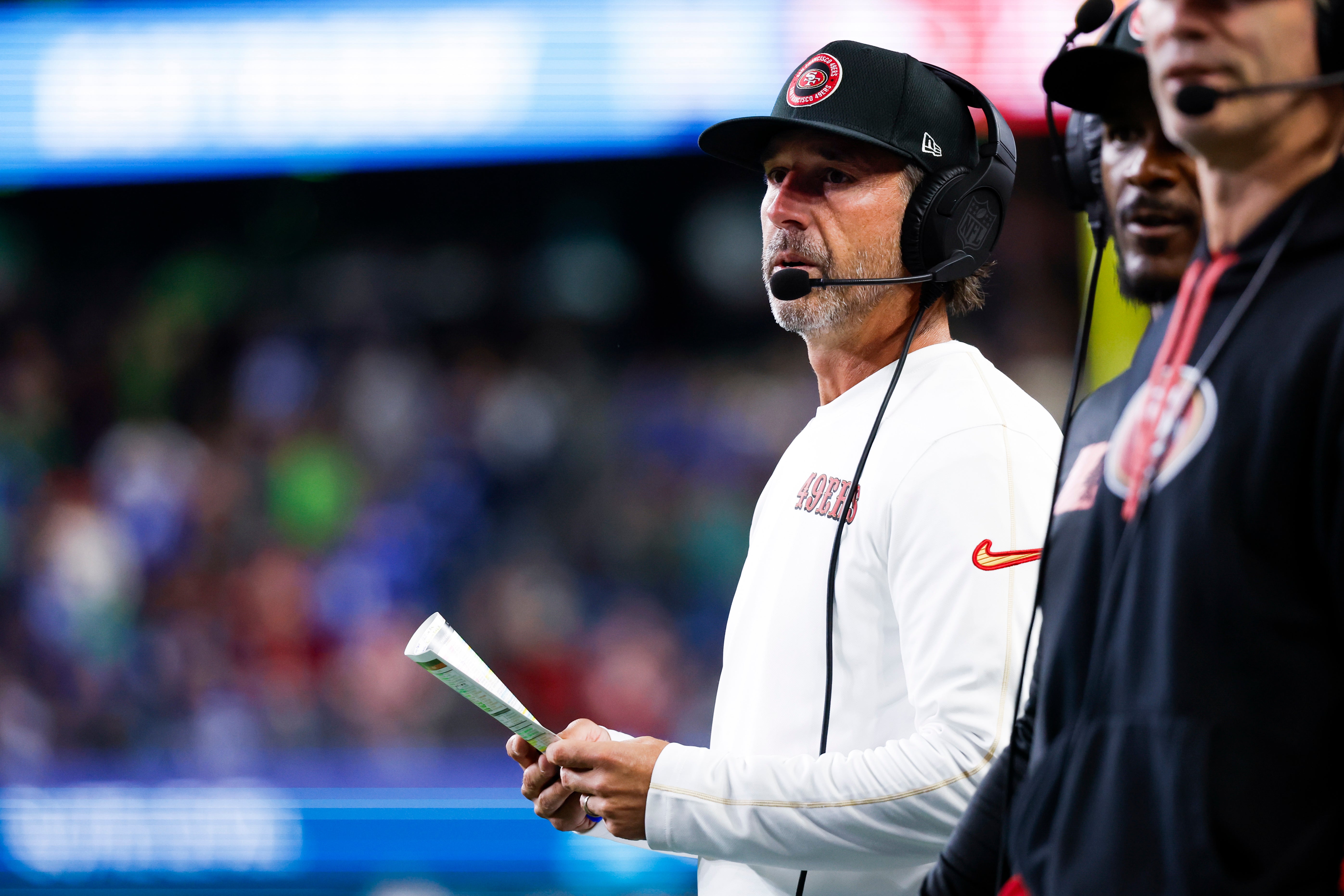 San Francisco 49ers head coach Kyle Shanahan stands on the sideline during the fourth quarter against the Seattle Seahawks at Lumen Field.