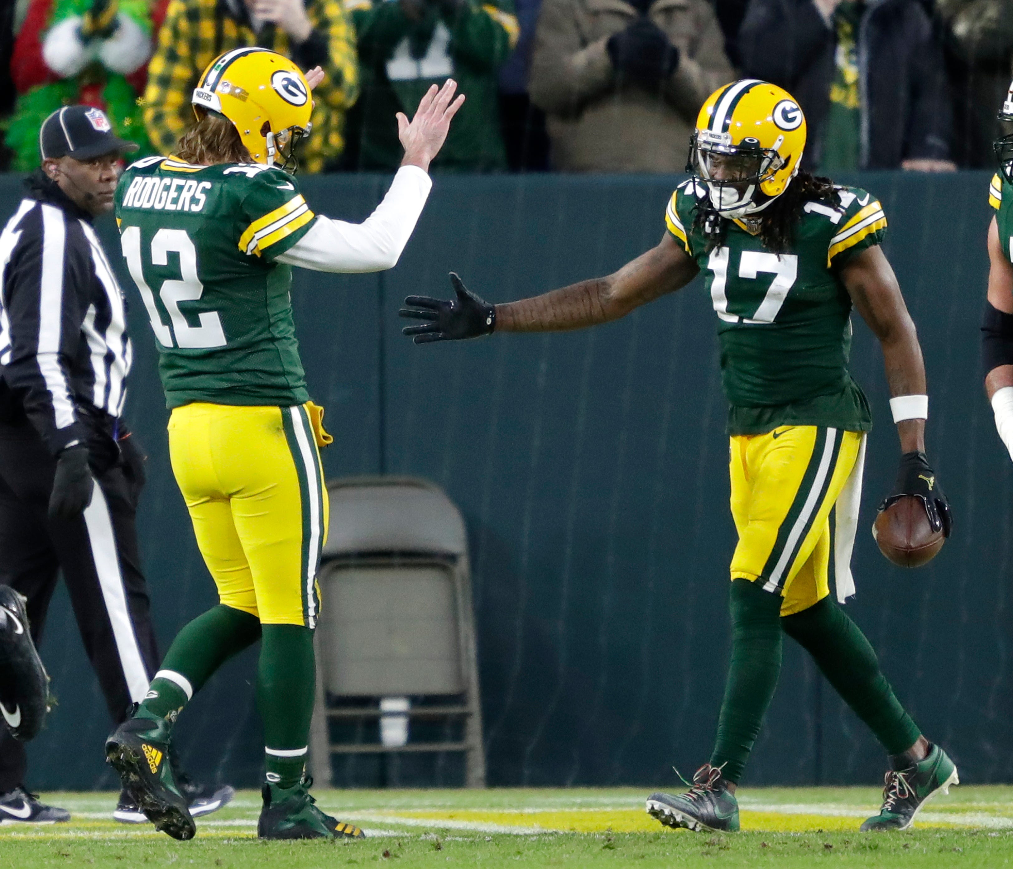 Green Bay Packers quarterback Aaron Rodgers (12) celebrates with wide receiver Davante Adams (17) after scoring a touchdown in the second quarter during their football game Saturday, December 25, 2021, at Lambeau Field in Green Bay, Wis. The touchdown Adams ahead of Jordy Nelsons for touchdown receptions from Rodgers.