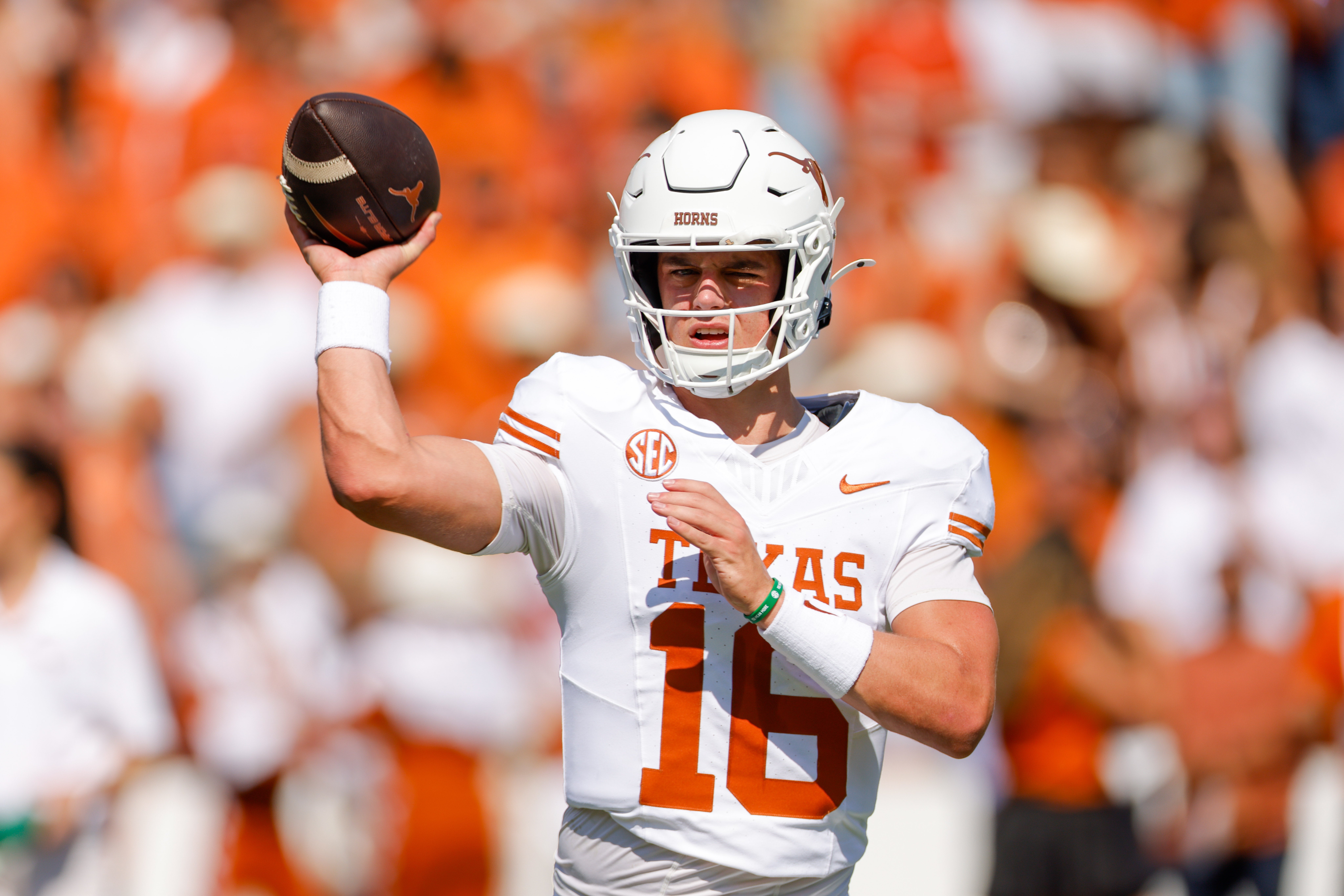 Texas Longhorns quarterback Arch Manning (16) warms up prior to the game against the Oklahoma Sooners at the Cotton Bowl.