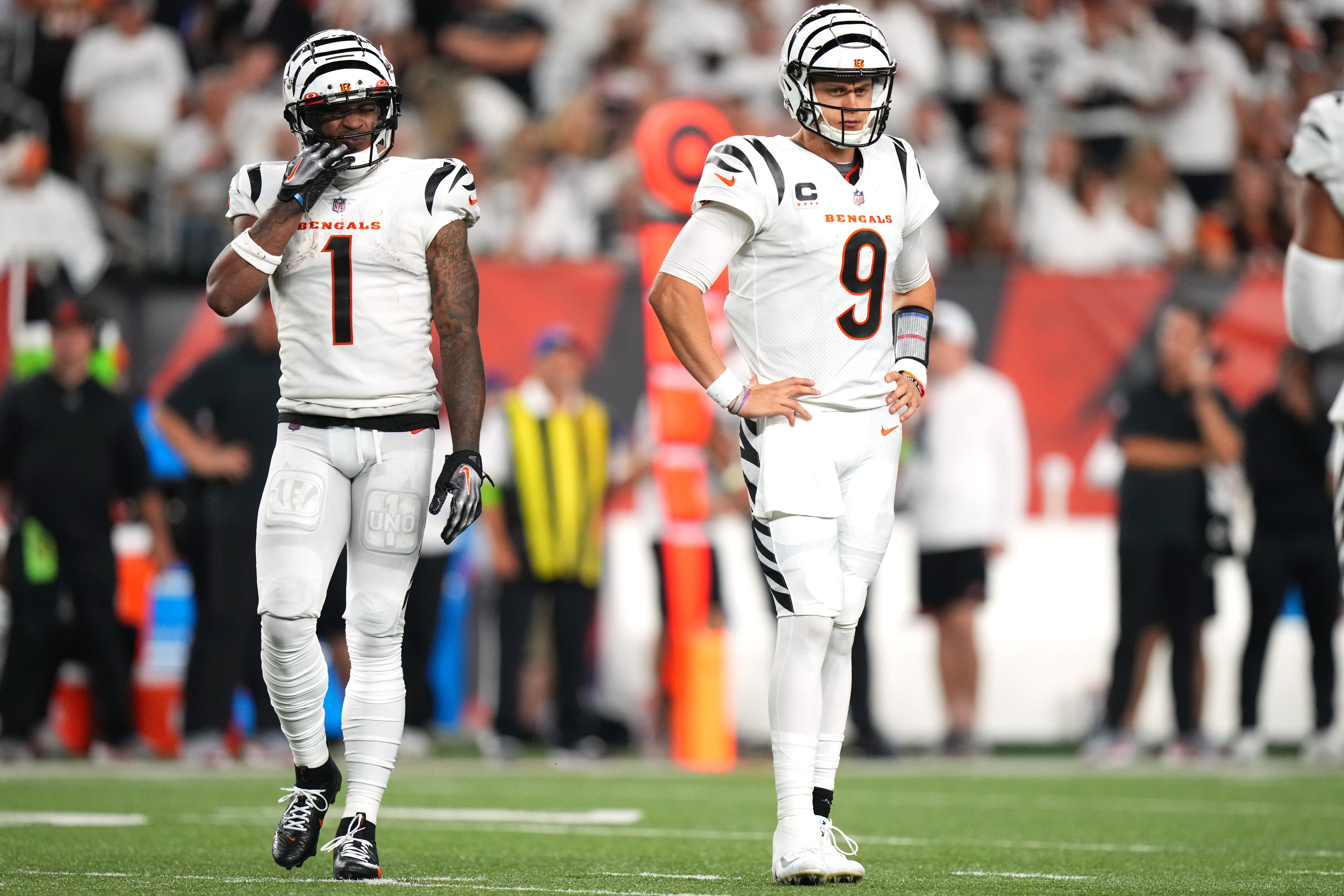 Cincinnati Bengals wide receiver Ja'Marr Chase (1) and Cincinnati Bengals quarterback Joe Burrow (9) get set for a play in the fourth quarter during a Week 3 NFL football game between the Los Angeles Rams and the Cincinnati Bengals, Monday, Sept. 25, 2023, at Paycor Stadium in Cincinnati. The Cincinnati Bengals won, 19-16.  