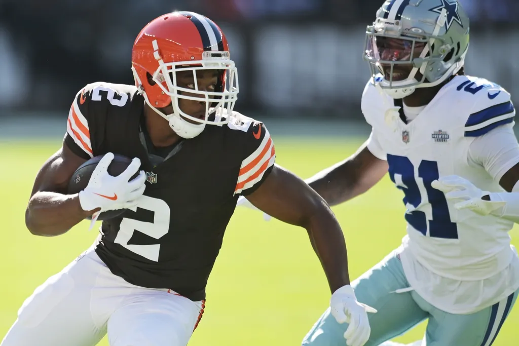 Cleveland Browns wide receiver Amari Cooper (2) runs with the ball after a catch as Dallas Cowboys cornerback Caelen Carson (21) defends during the first quarter at Huntington Bank Field.