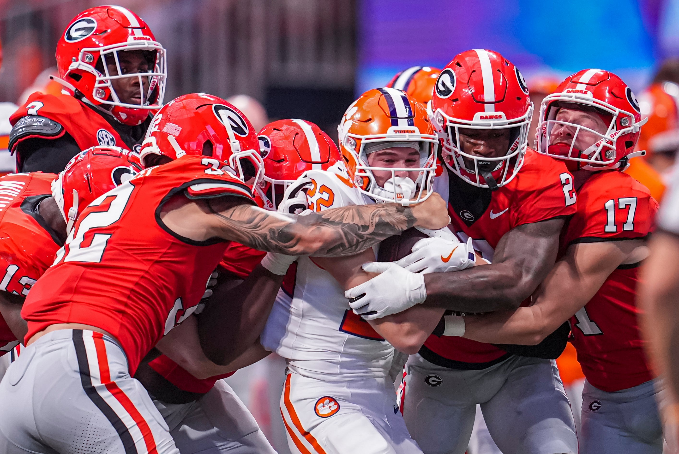 Clemson Tigers wide receiver Cole Turner (22) is gang tackled by the Georgia Bulldogs defense including linebacker Smael Mondon Jr. (2) and linebacker Chaz Chambliss (32) during the second half