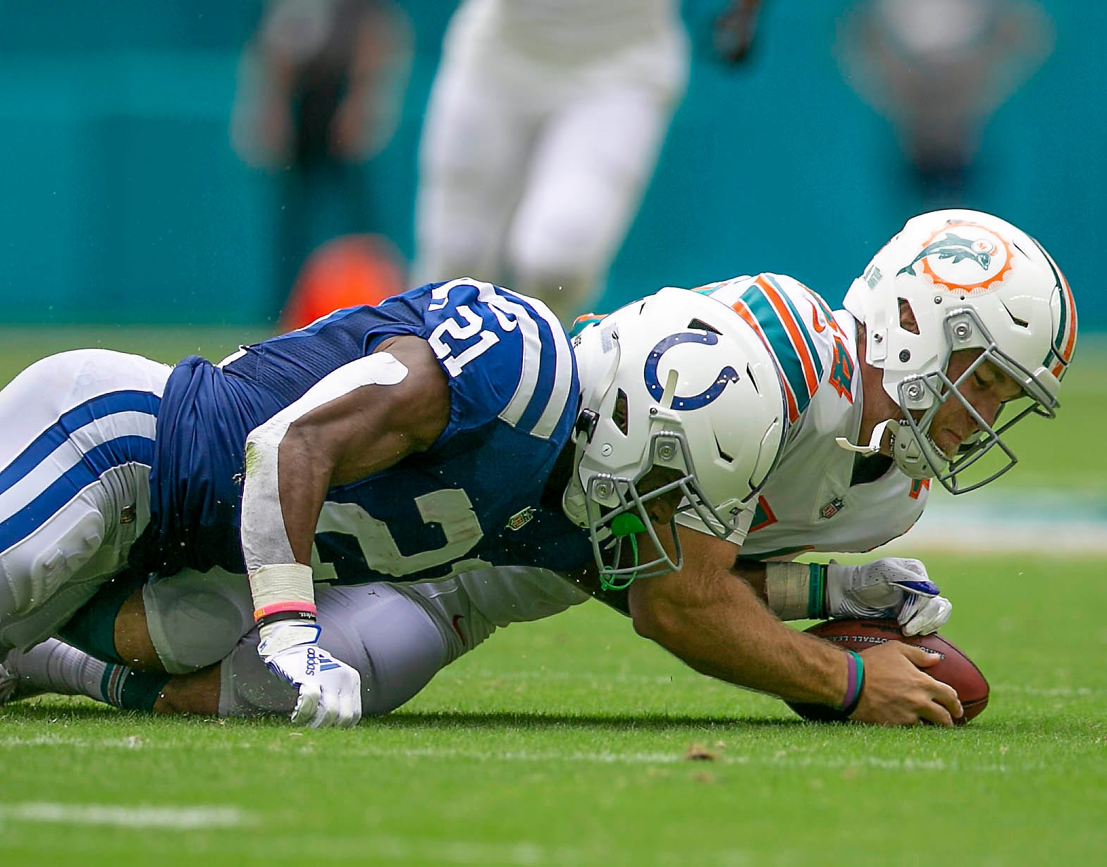 Miami Dolphins Miami Dolphins long snapper Blake Ferguson (44), recovers a fumble by Indianapolis Colts running back Nyheim Hines (21), during NFL game at Hard Rock Stadium Sunday in Miami Gardens.