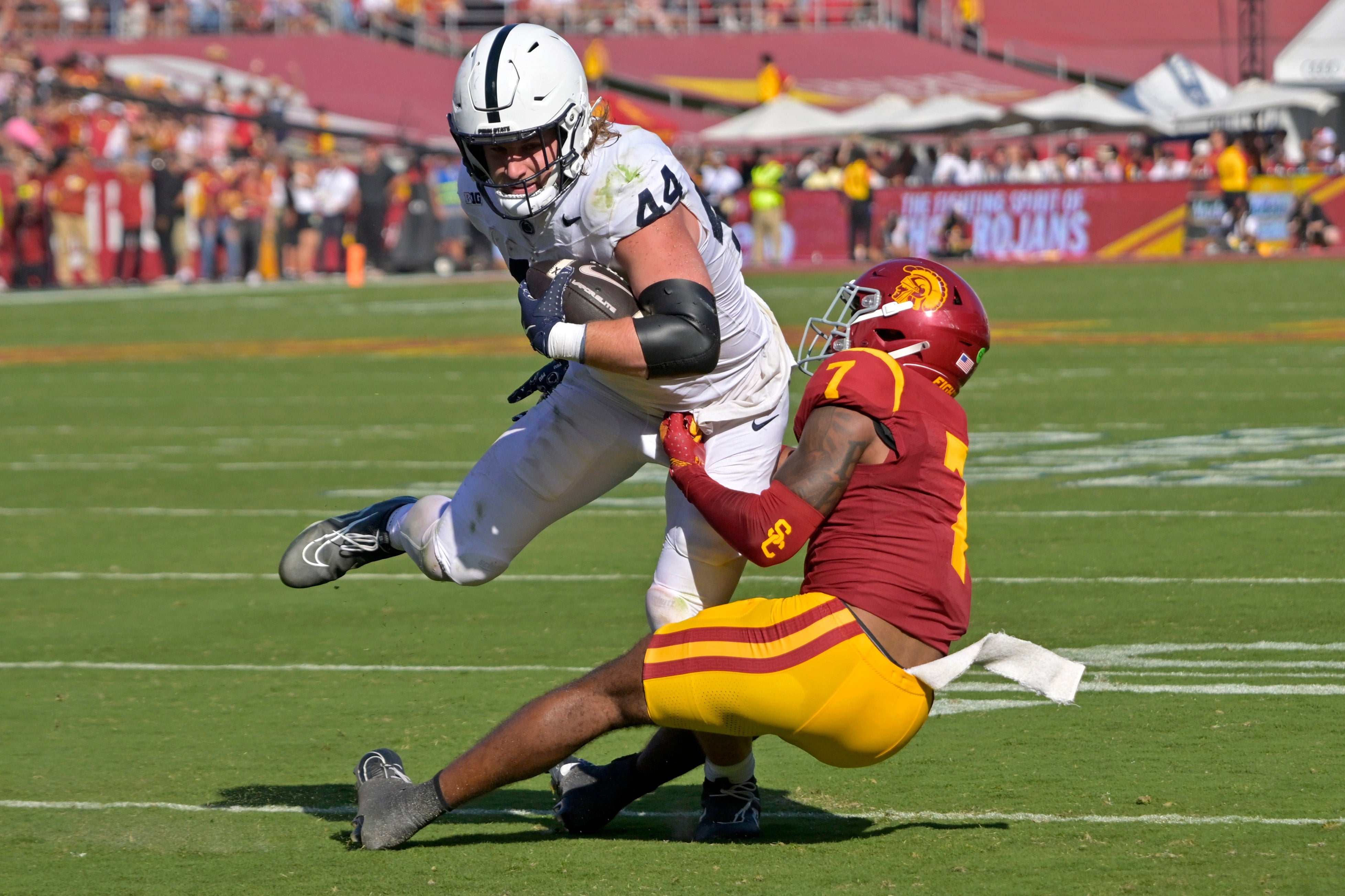 Penn State Nittany Lions tight end Tyler Warren (44) is stopped by USC Trojans safety Kamari Ramsey (7) after a short gain in the second half at United Airlines Field at the Los Angeles Memorial Coliseum.