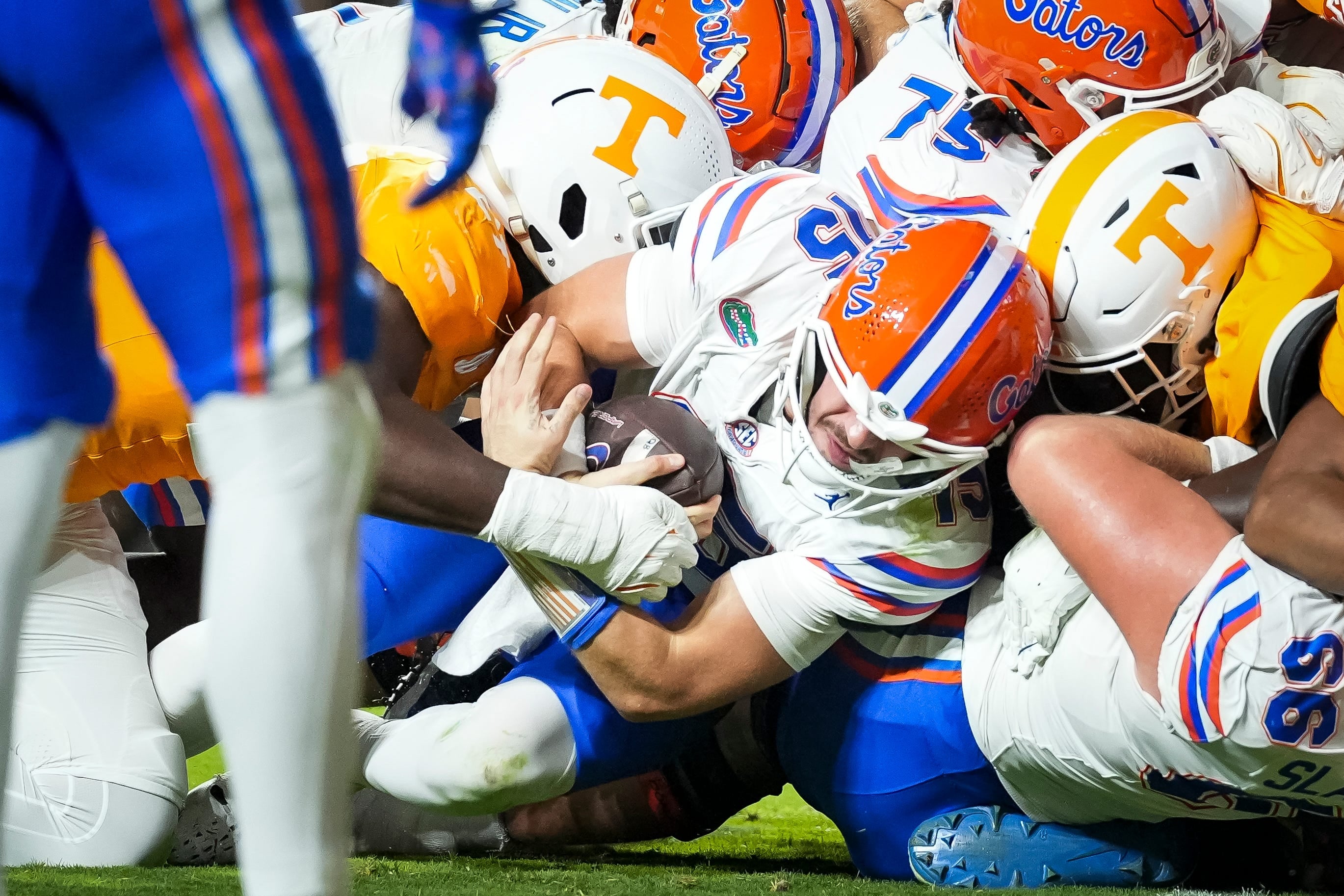Florida Gators quarterback Graham Mertz (15) is tackled by Tennessee Volunteers defensive lineman James Pearce Jr. (27) before fumbling the ball at the goal line during a game
