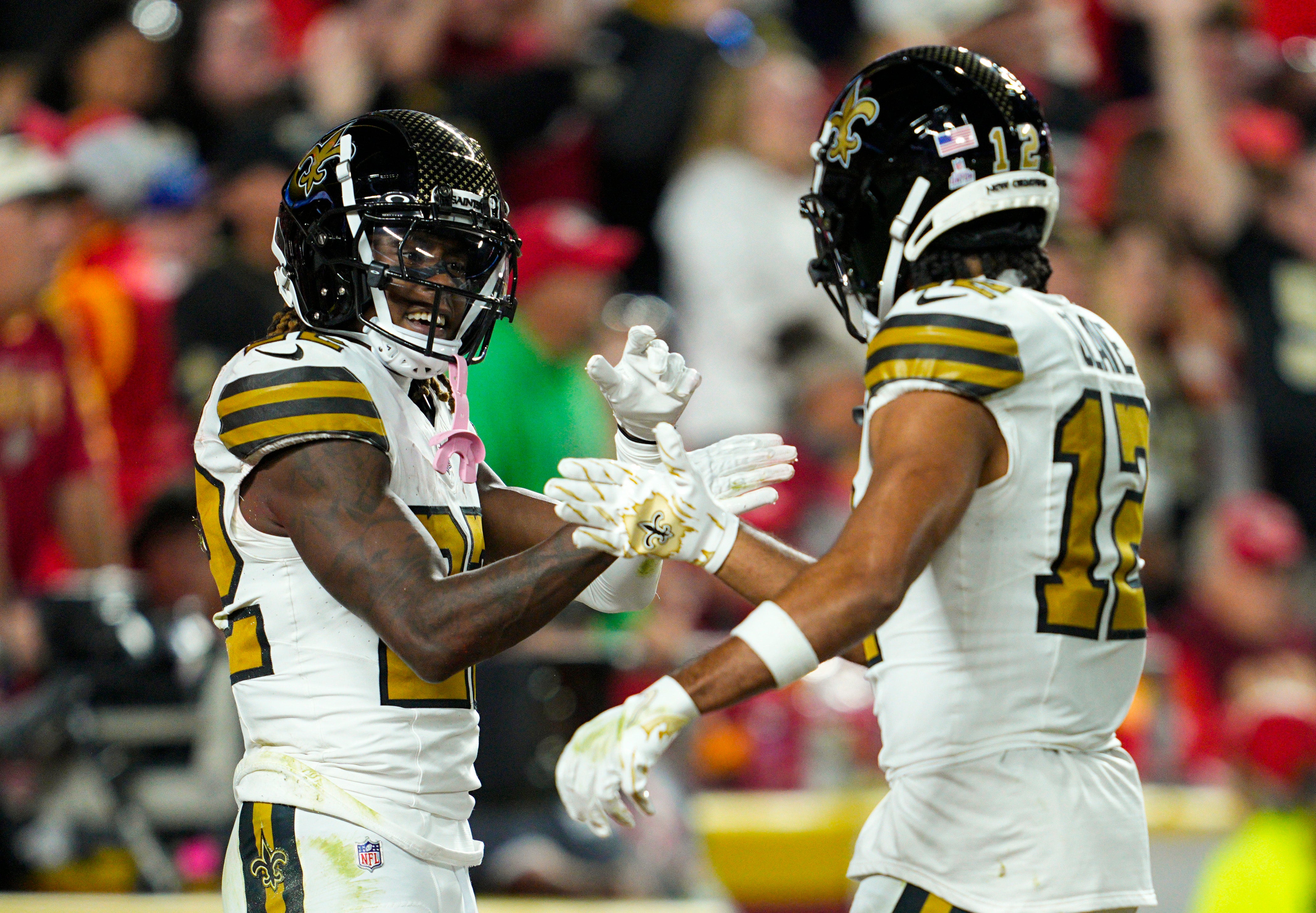 Oct 7, 2024; Kansas City, Missouri, USA; New Orleans Saints wide receiver Rashid Shaheed (22) celebrates with wide receiver Chris Olave (12) after scoring a touchdown during the first half against the Kansas City Chiefs at GEHA Field at Arrowhead Stadium.