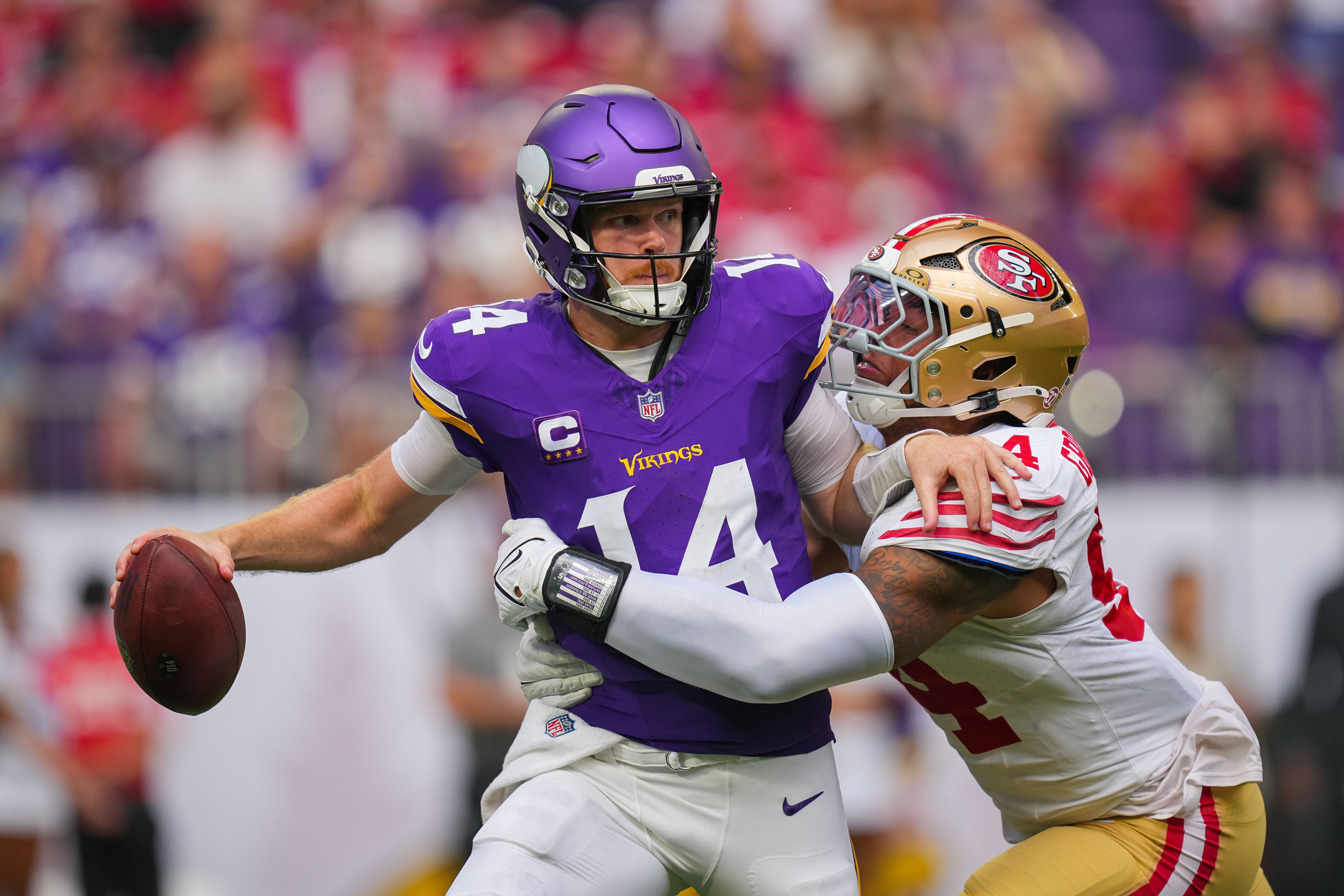 San Francisco 49ers defensive end Yetur Gross-Matos (94) tackles Minnesota Vikings quarterback Sam Darnold (14) in the third quarter at U.S. Bank Stadium.