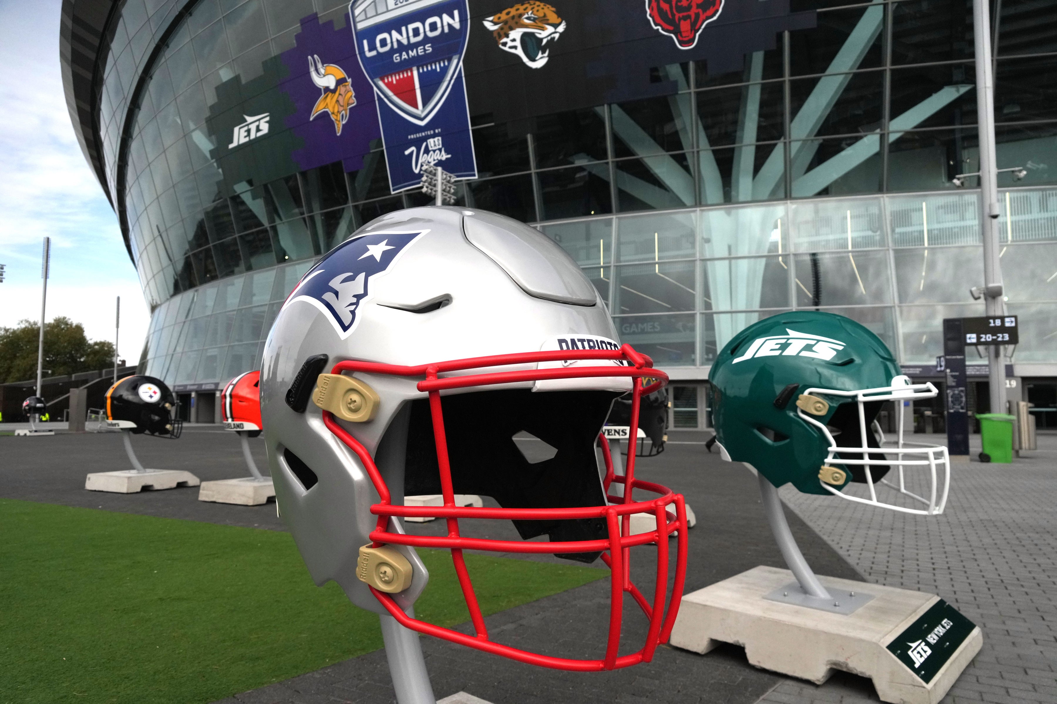 Oct 13, 2024; London, United Kingdom; Large helmets of the New England Patriots and New York Jets at an NFL International Series game at Tottenham Hotspur Stadium.