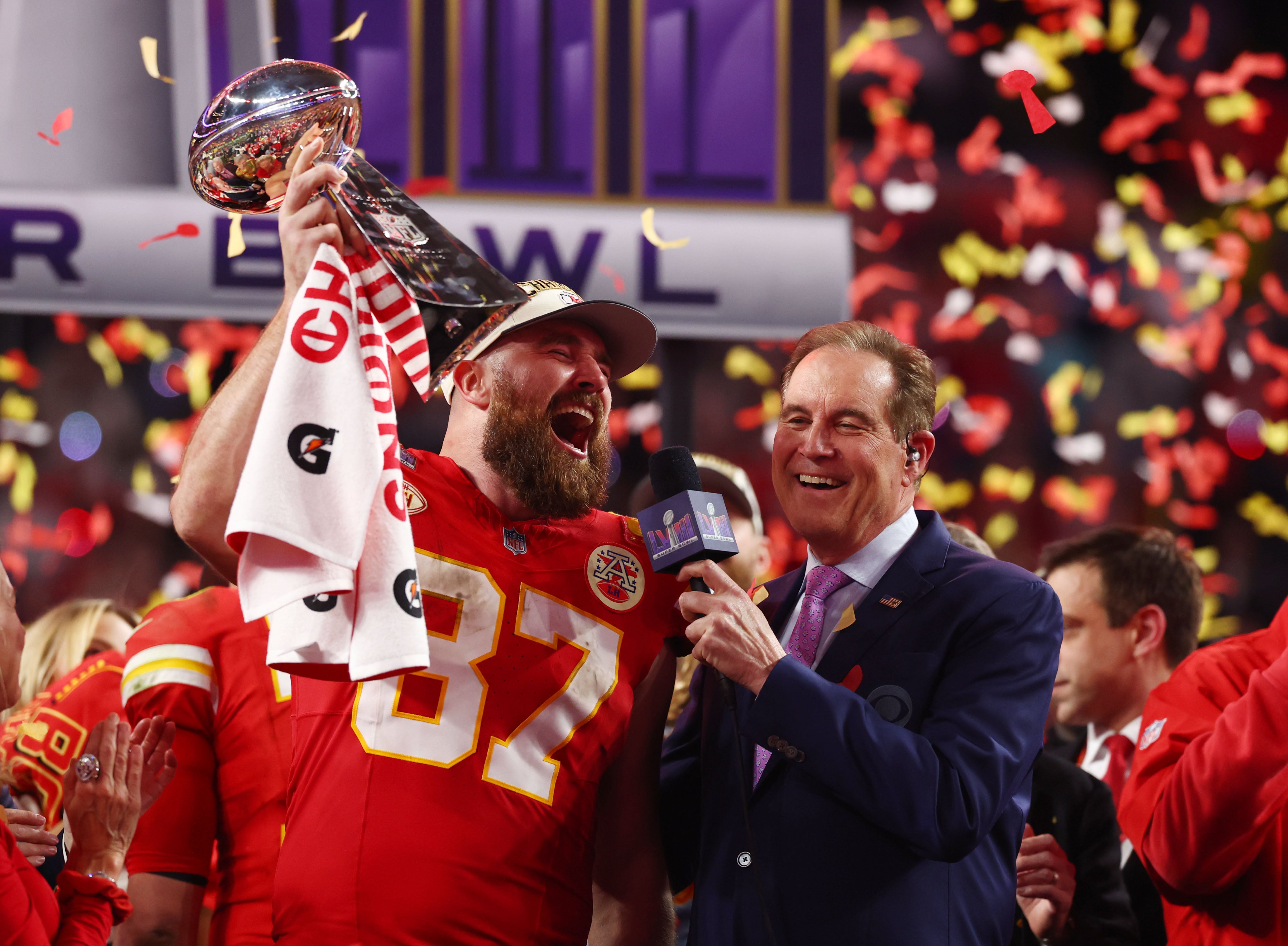 Feb 11, 2024; Paradise, Nevada, USA; Kansas City Chiefs tight end Travis Kelce (87) celebrates with the Vince Lombardi Trophy after defeating the San Francisco 49ers in Super Bowl LVIII at Allegiant Stadium.