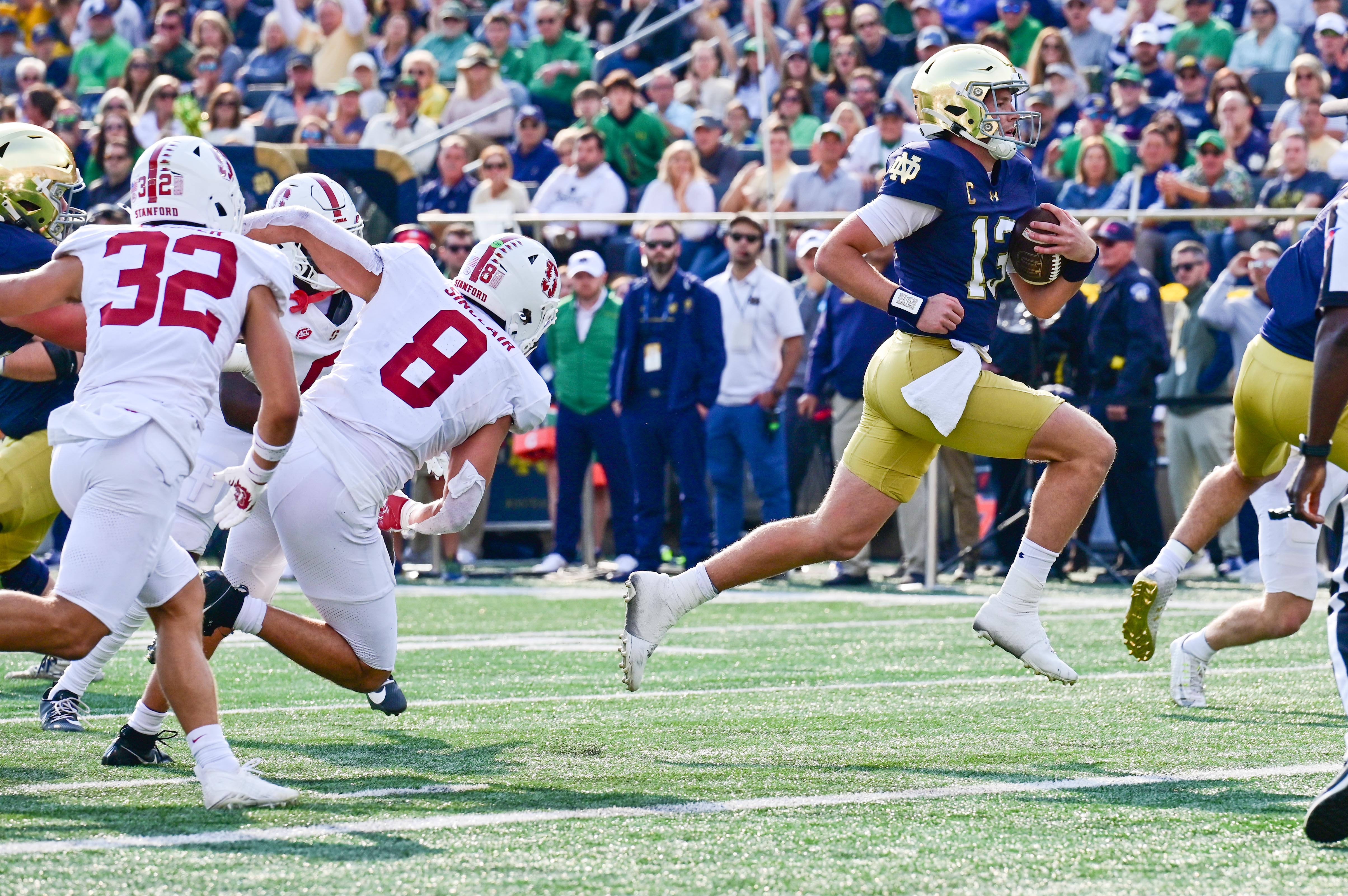Notre Dame Fighting Irish quarterback Riley Leonard (13) runs for a touchdown in the first quarter against the Stanford Cardinal at Notre Dame Stadium.