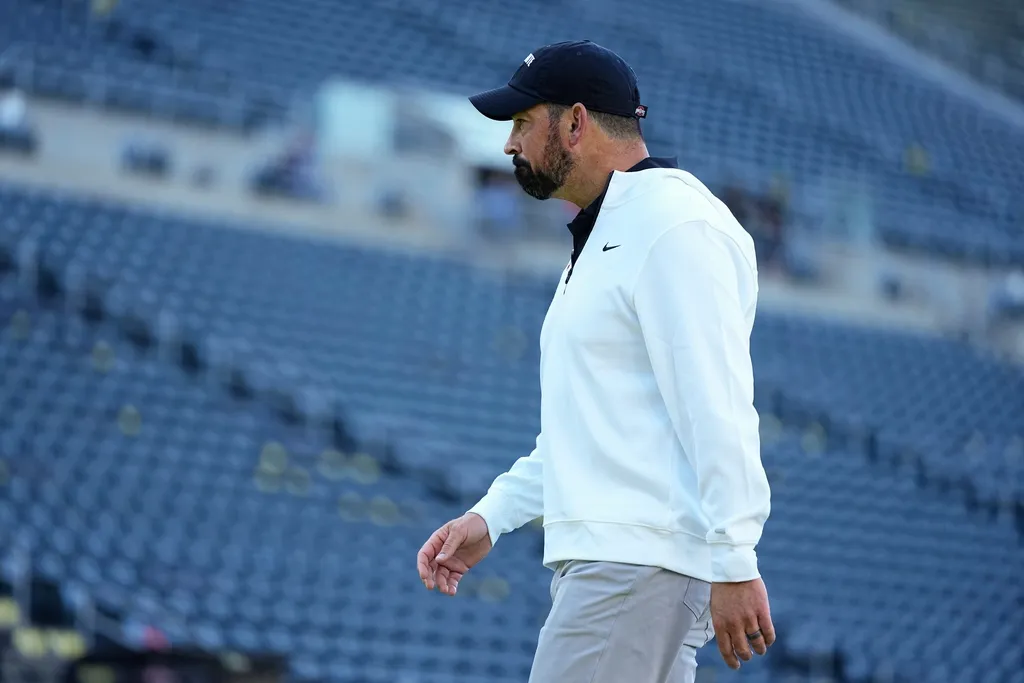 Ohio State Buckeyes head coach Ryan Day walks across the field at Autzen Stadium prior to the NCAA football game against the Oregon Ducks