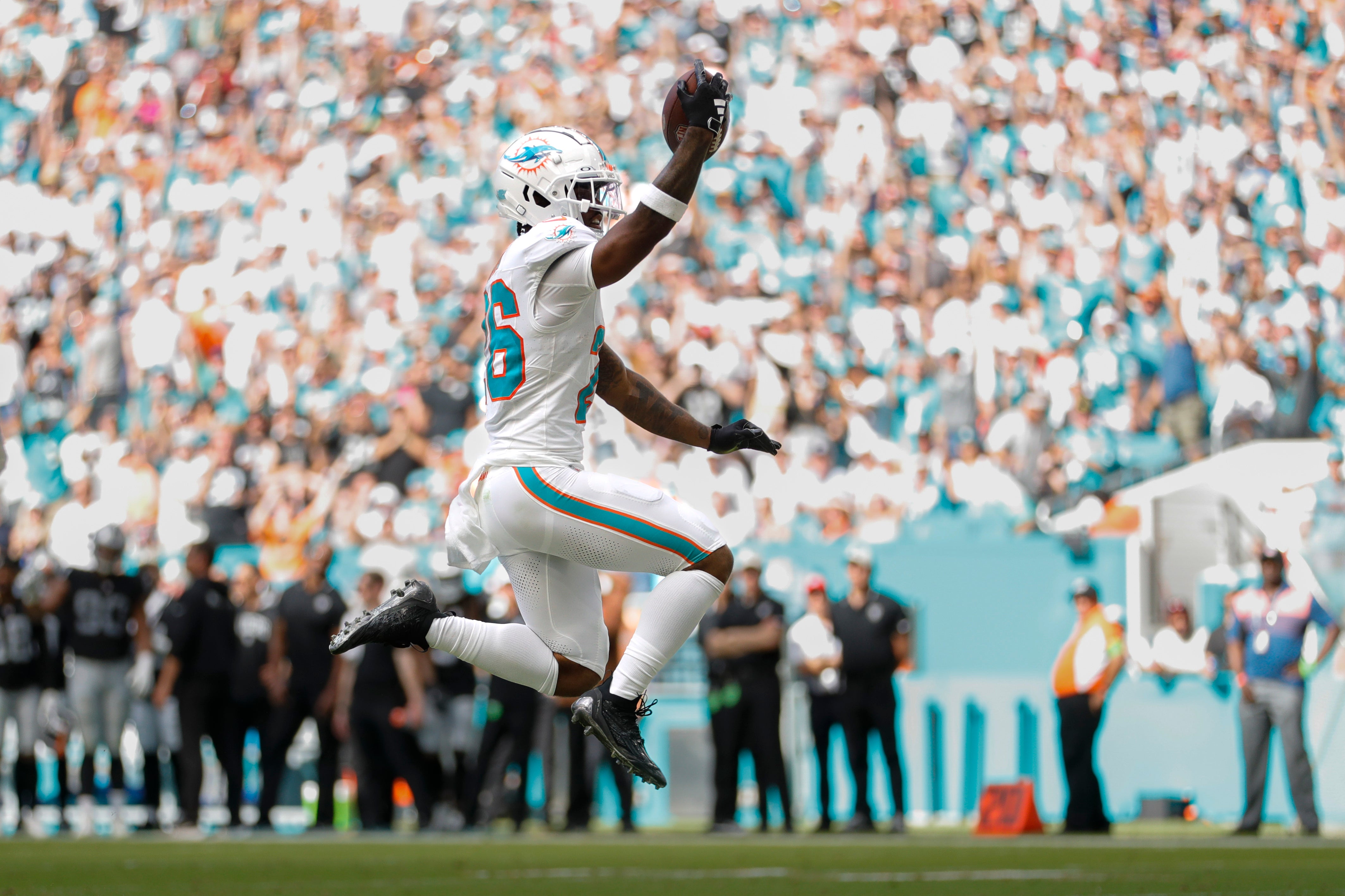 Nov 19, 2023; Miami Gardens, Florida, USA; Miami Dolphins running back Salvon Ahmed (26) reacts after scoring a touchdown against the Las Vegas Raiders during the second quarter at Hard Rock Stadium.
