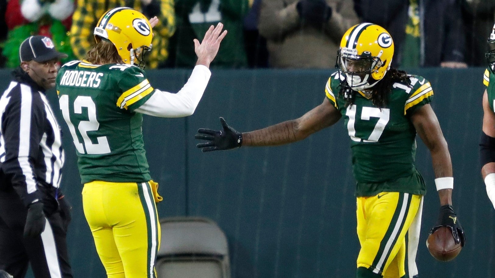 Green Bay Packers quarterback Aaron Rodgers (12) celebrates with wide receiver Davante Adams (17) after scoring a touchdown in the second quarter during their football game Saturday, December 25, 2021, at Lambeau Field in Green Bay, Wis. The touchdown Adams ahead of Jordy Nelsons for touchdown receptions from Rodgers.