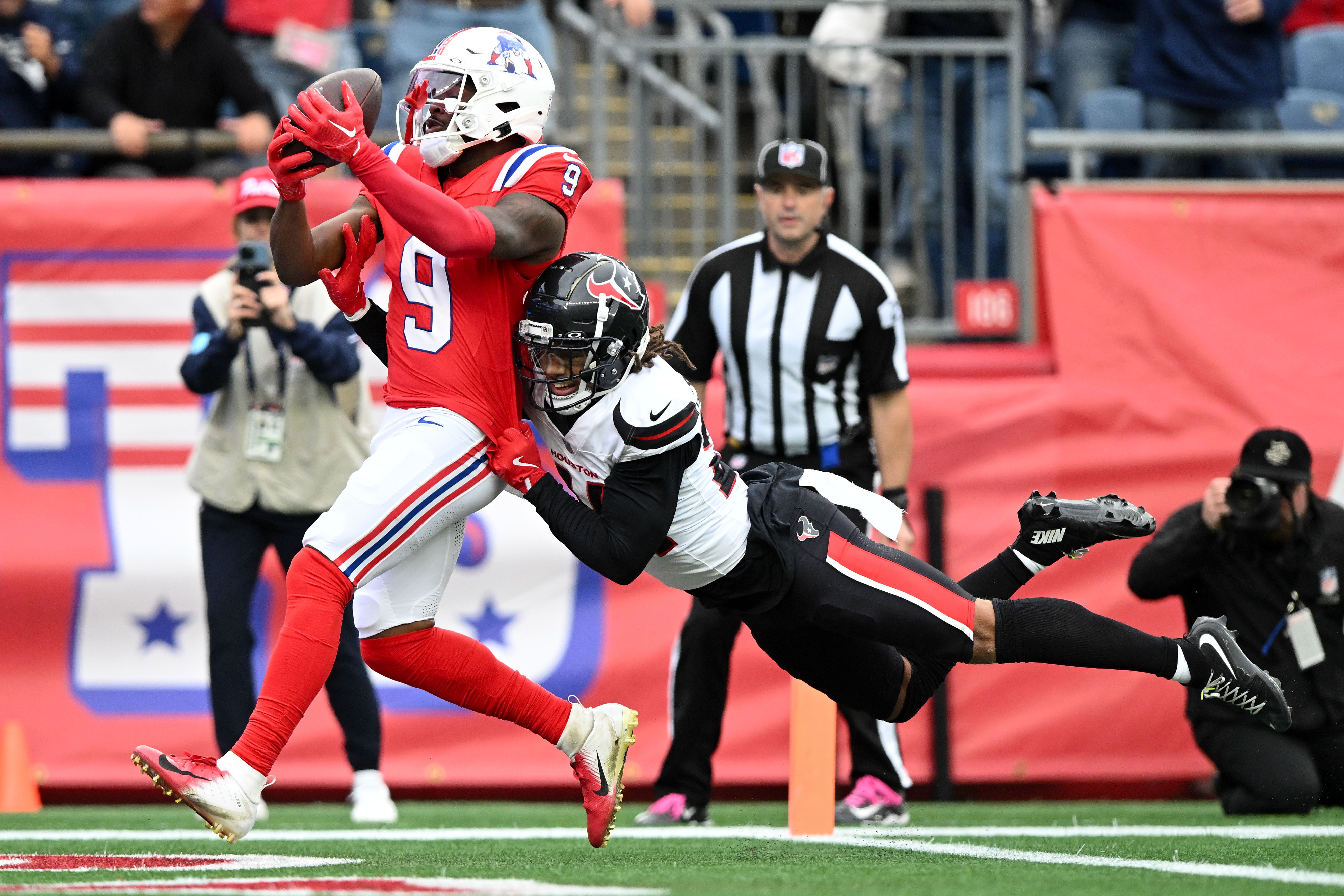 Oct 13, 2024; Foxborough, Massachusetts, USA; New England Patriots wide receiver Kayshon Boutte (9) scores a touchdown against the Houston Texans during the first half at Gillette Stadium.