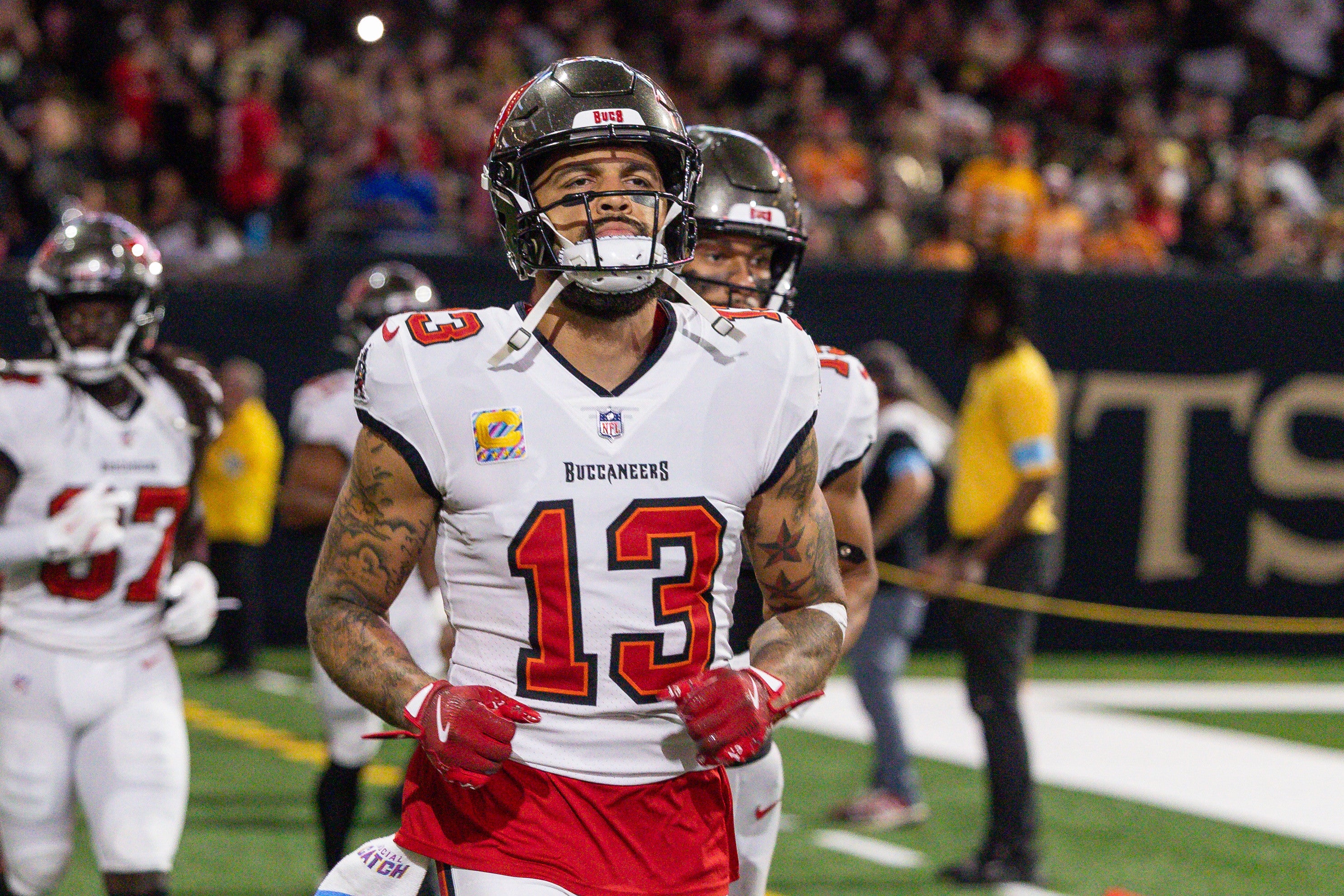 Oct 13, 2024; New Orleans, Louisiana, USA; Tampa Bay Buccaneers wide receiver Mike Evans (13) runs on the field agains the New Orleans Saints during the first half at Caesars Superdome.