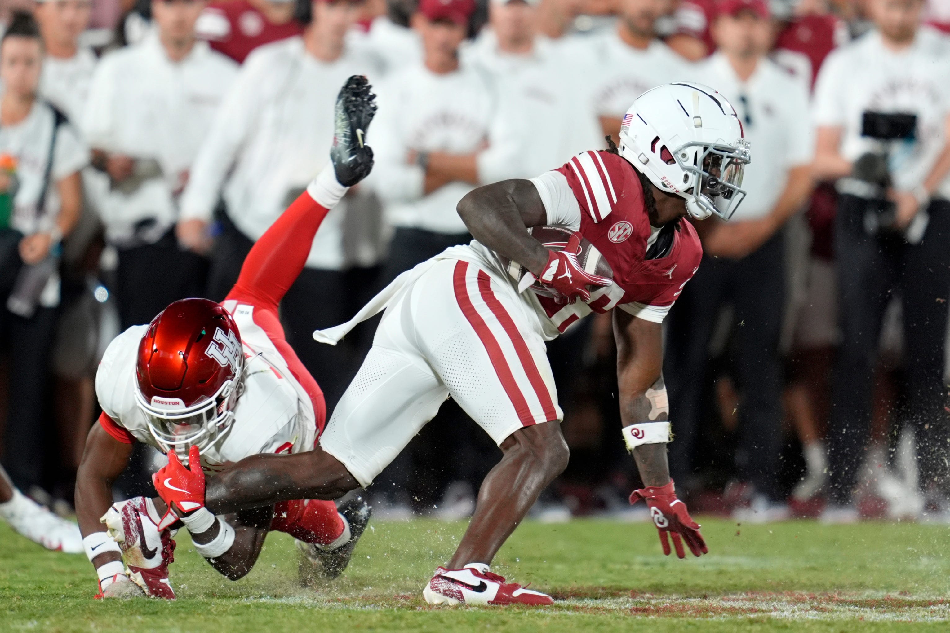 Oklahoma Sooners wide receiver Deion Burks (6) tries to get past Houston Cougars defensive back Kentrell Webb (8) after a reception during a college football game between the University of Oklahoma Sooners (OU) and the Houston Cougars at Gaylord Family – Oklahoma Memorial Stadium in Norman, Okla., Saturday, Sept. 7, 2024.