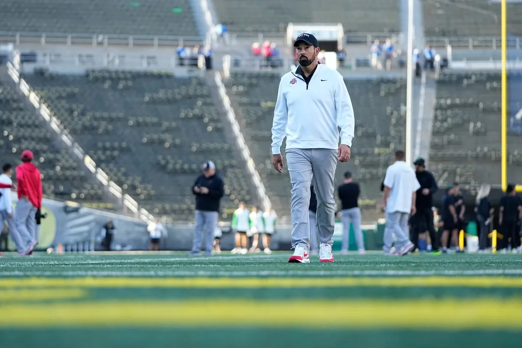 Ohio State Buckeyes head coach Ryan Day walks across the field at Autzen Stadium prior to the NCAA football game against the Oregon Ducks