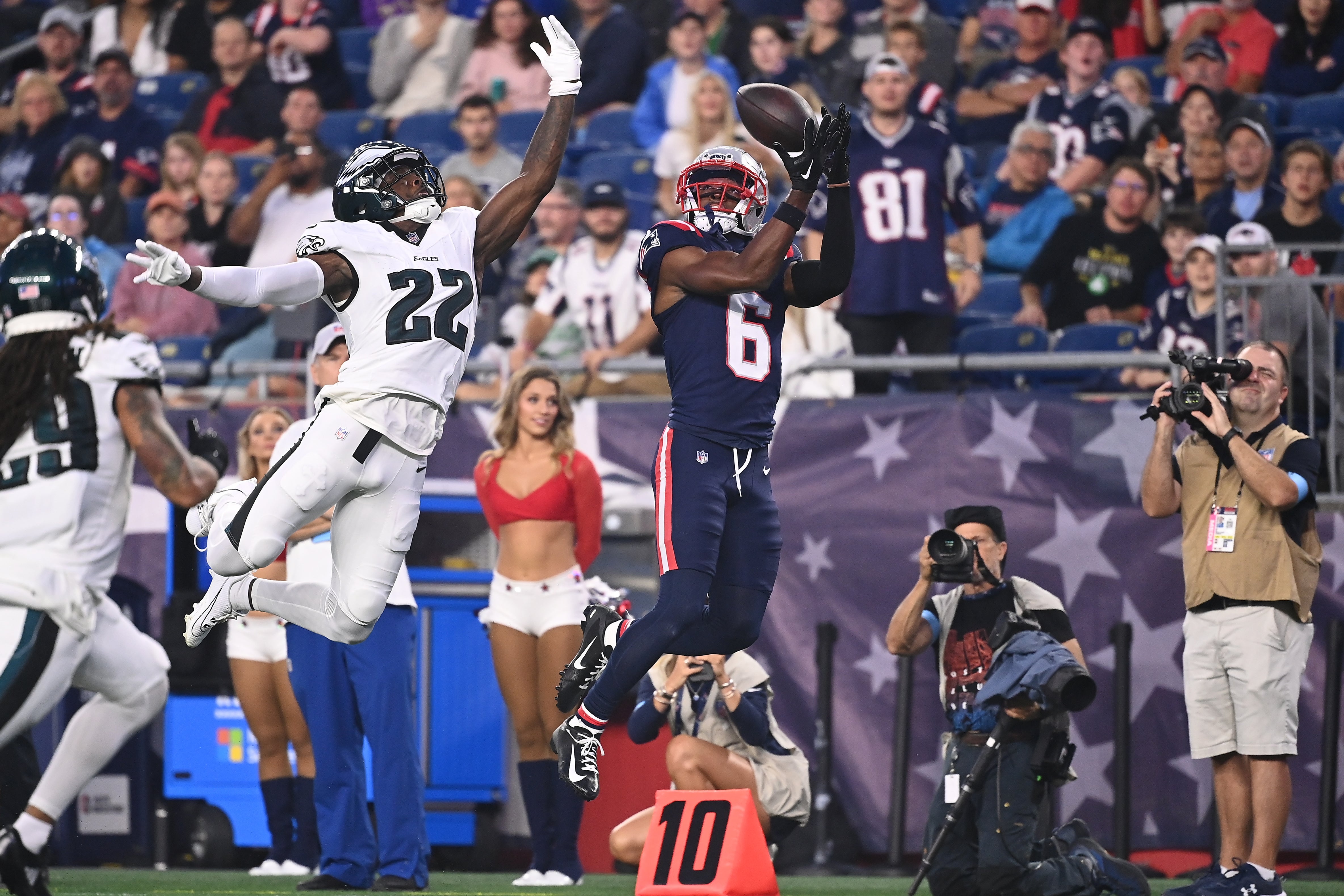 Aug 15, 2024; Foxborough, MA, USA; New England Patriots wide receiver Javon Baker (6) tris to make a catch while being covered by Philadelphia Eagles cornerback Kelee Ringo (22) during the first half at Gillette Stadium.