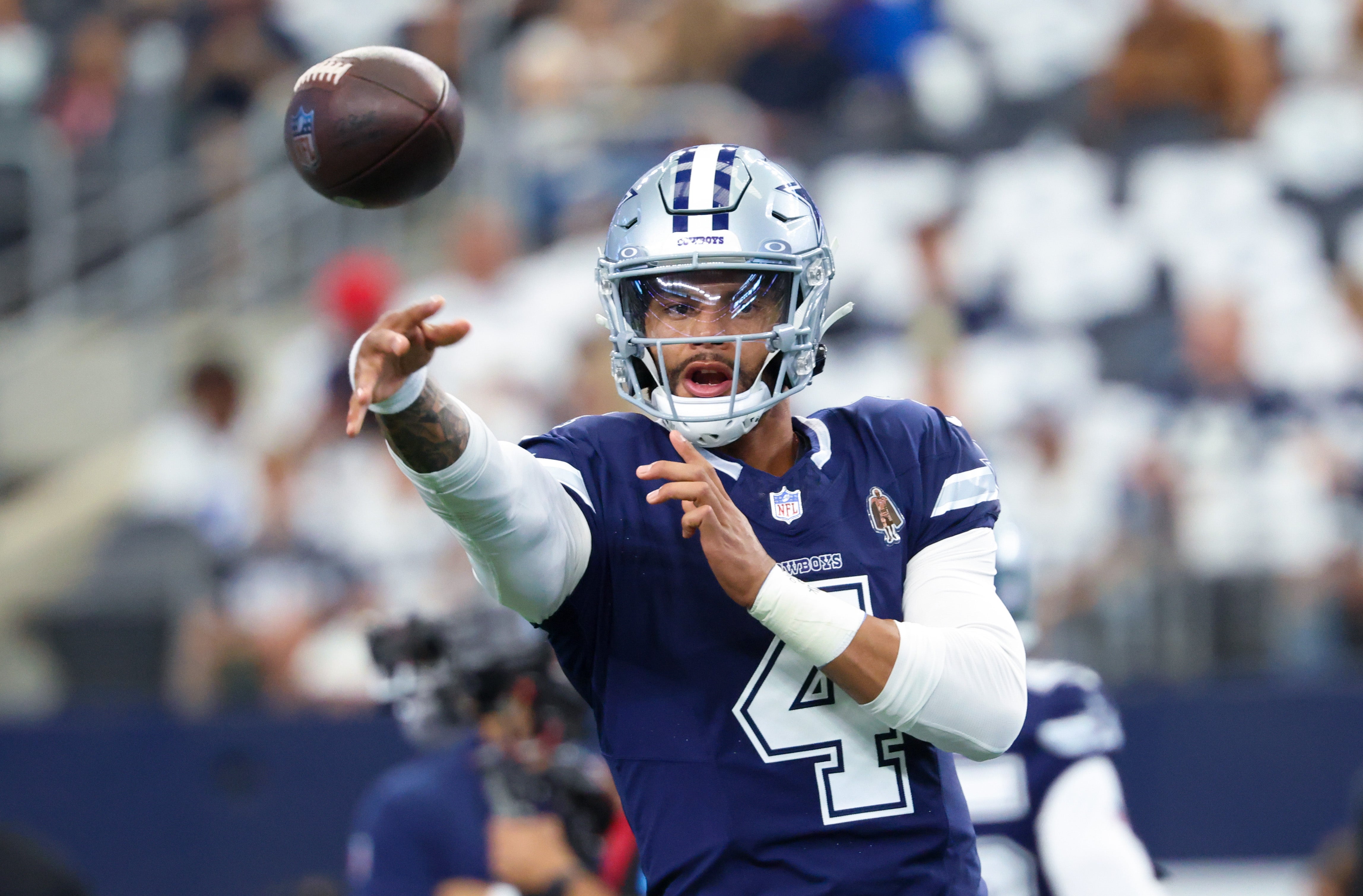 Dallas Cowboys quarterback Dak Prescott (4) warms up before the game against the Detroit Lions at AT&T Stadium.