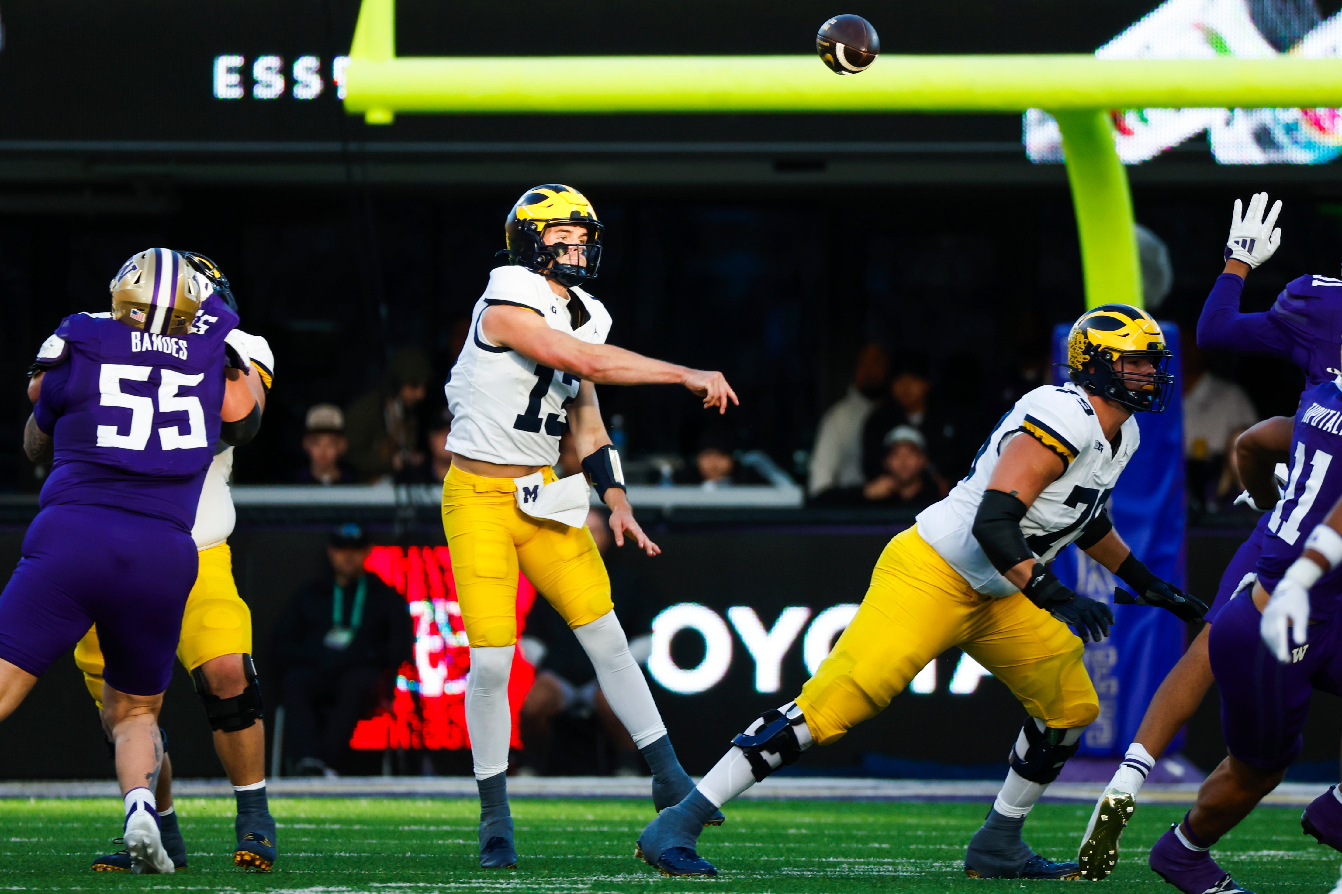 Oct 5, 2024; Seattle, Washington, USA; Michigan Wolverines quarterback Jack Tuttle (13) passes against the Washington Huskies during the second quarter at Alaska Airlines Field at Husky Stadium. 