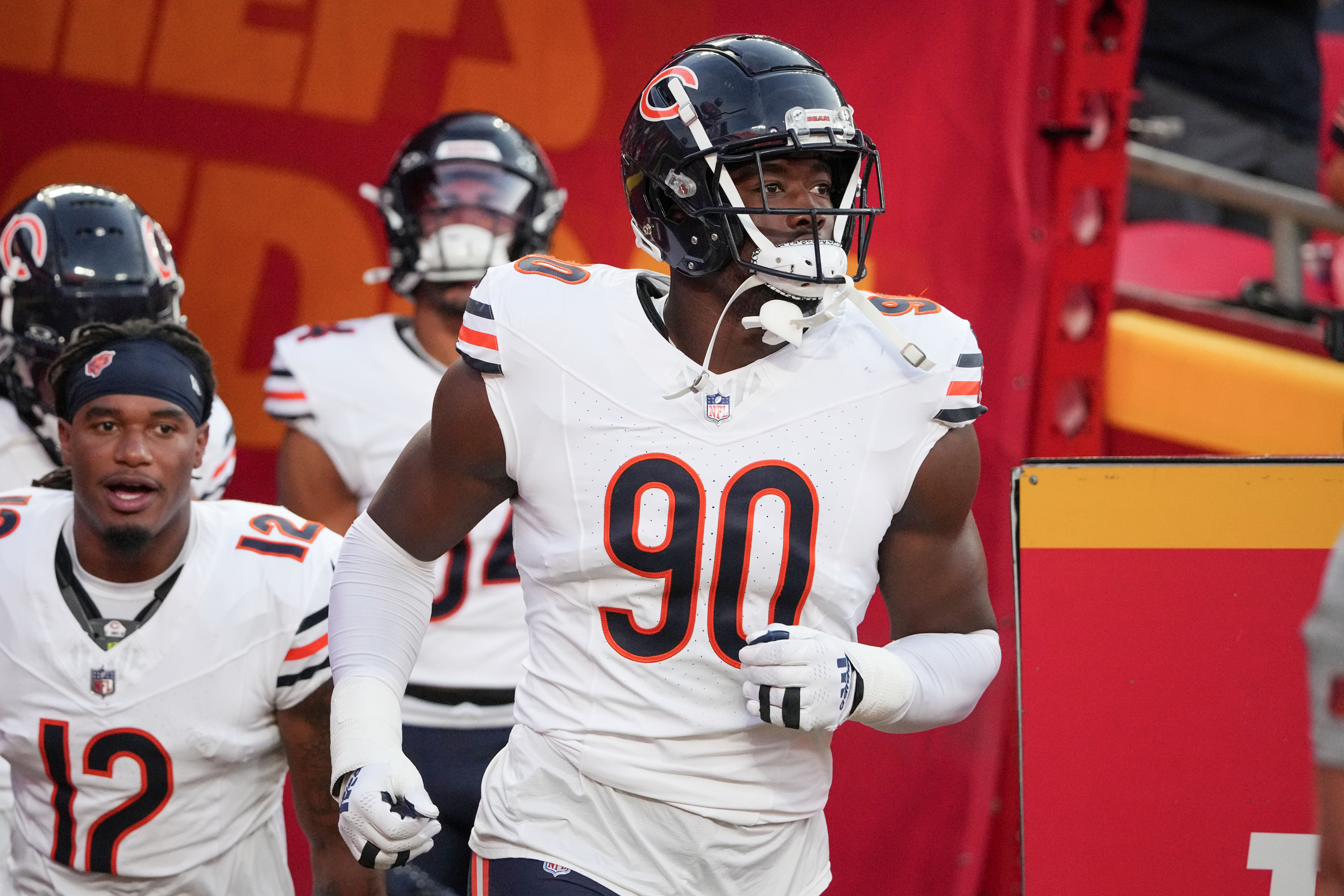 Aug 22, 2024; Kansas City, Missouri, USA; Chicago Bears defensive end Dominique Robinson (90) runs onto the field against the Kansas City Chiefs prior to a game at GEHA Field at Arrowhead Stadium.