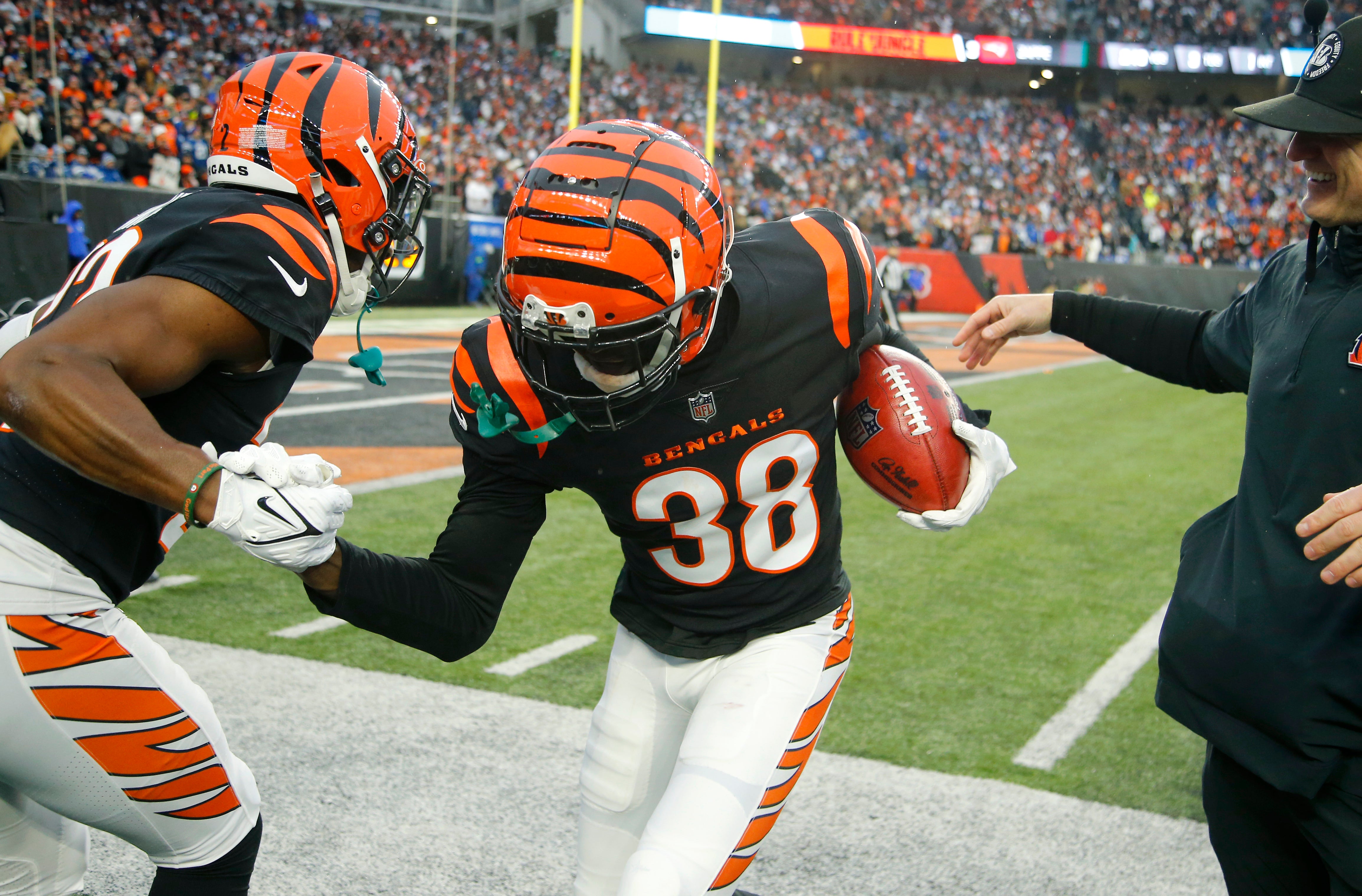 Dec 10, 2023; Cincinnati, Ohio, USA; Cincinnati Bengals cornerback DJ Ivey (38) celebrates his fumble recovery with cornerback Chidobe Awuzie (22) during the second half against the Indianapolis Colts at Paycor Stadium.