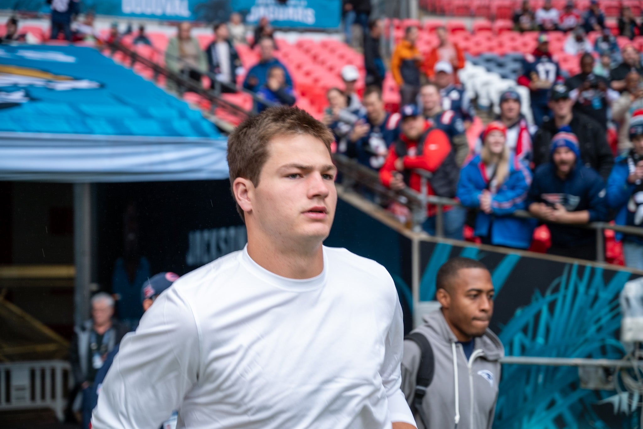 Drake Maye runs out onto the field prior to the New England Patriots game against the Jacksonville Jaguars at Wembley Stadium - Sunday, Oct. 20, 2024